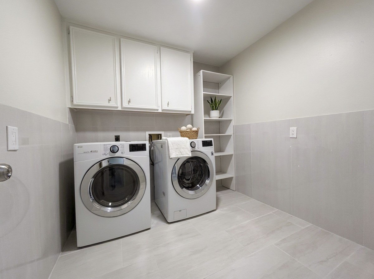 Spacious Utility room on the first floor located  near the kitchen with washer and dryer included.