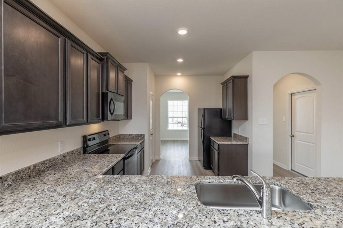 Kitchen with granite countertops.