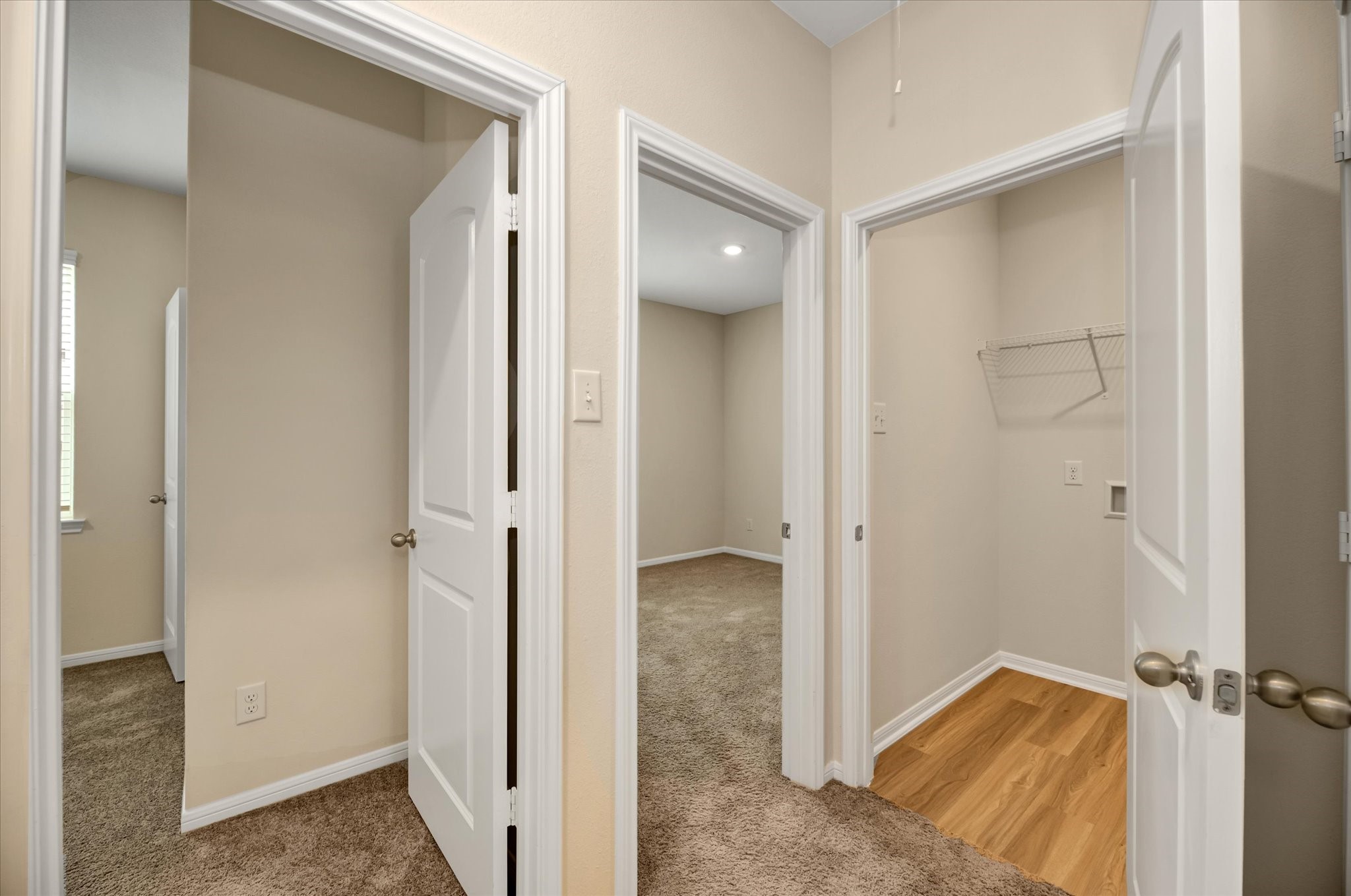 Two secondary bedrooms, laundry room and a linen closet next to it.
