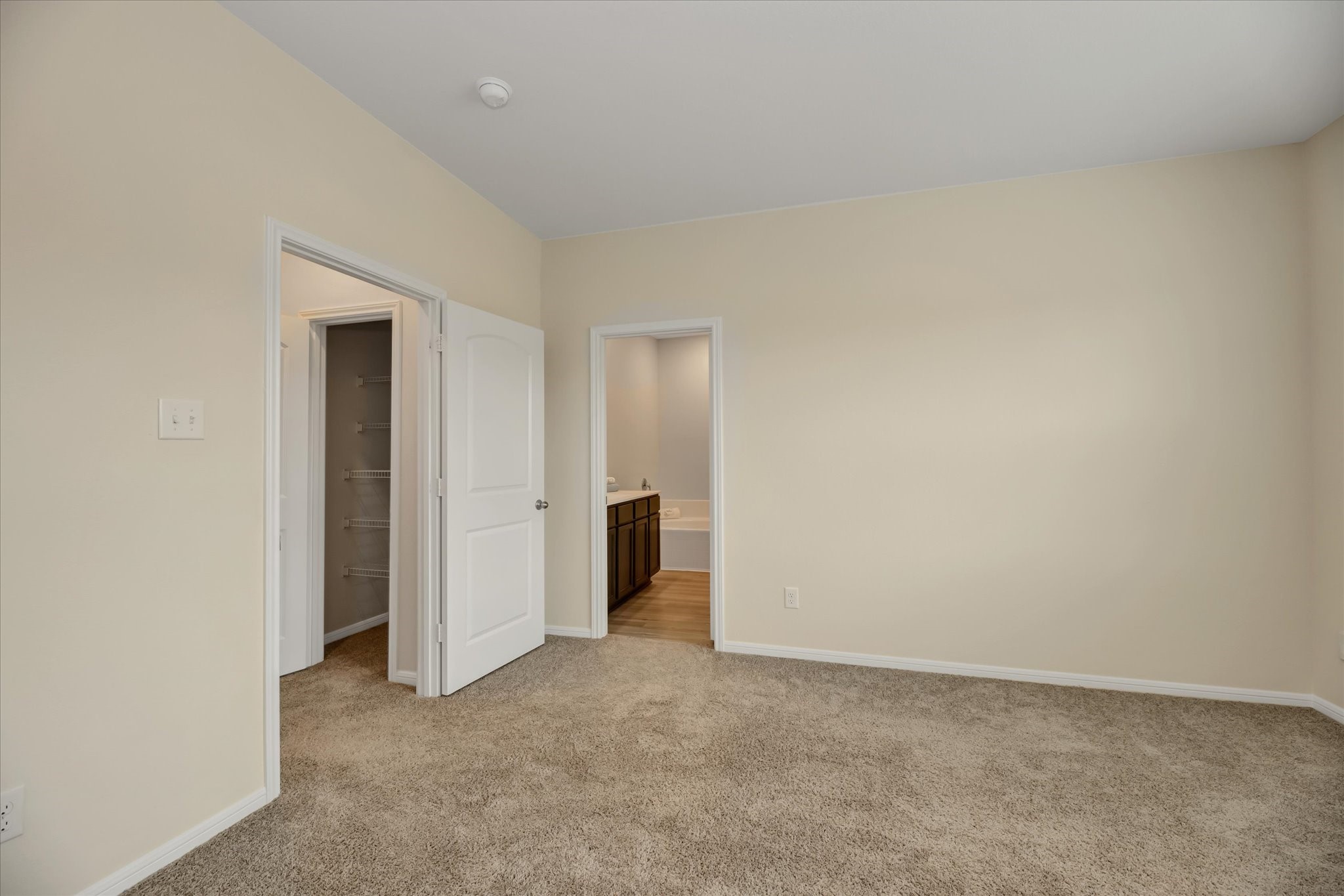 Primary bedroom, linen closet at the corridor.