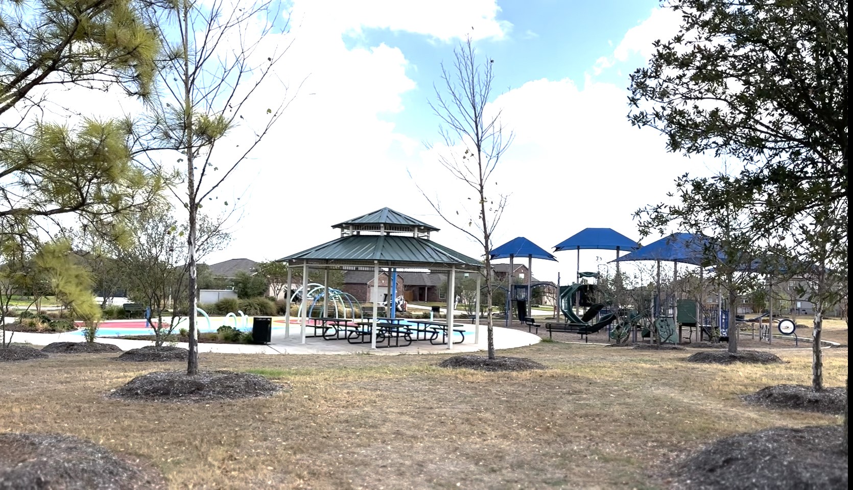 Community park with splash pad, playground and picnic area.