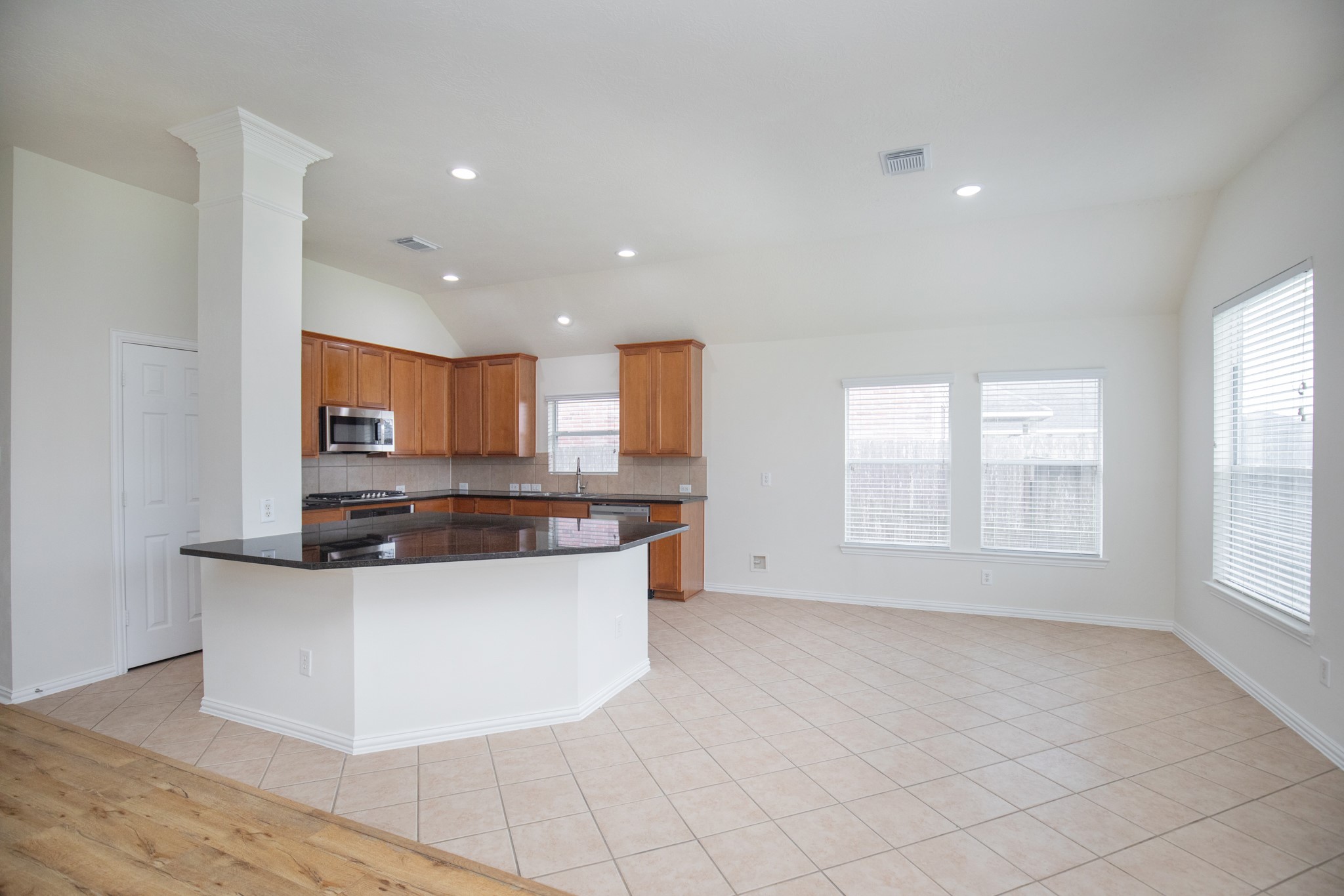 Spacious island kitchen open to look breakfast area, family room and backyard etc...