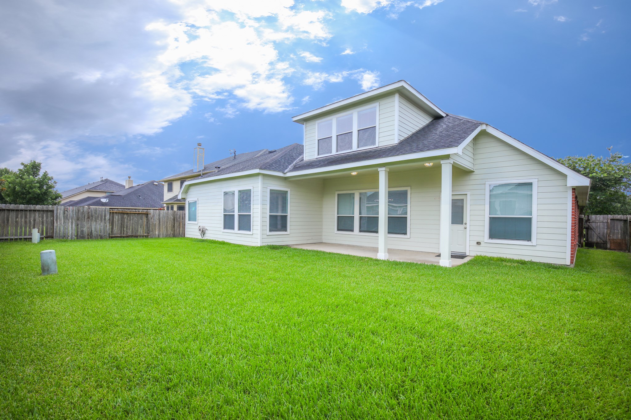 Spacious backyard with 23x11 covered porch to provide enough different backyard activities for you for pets..