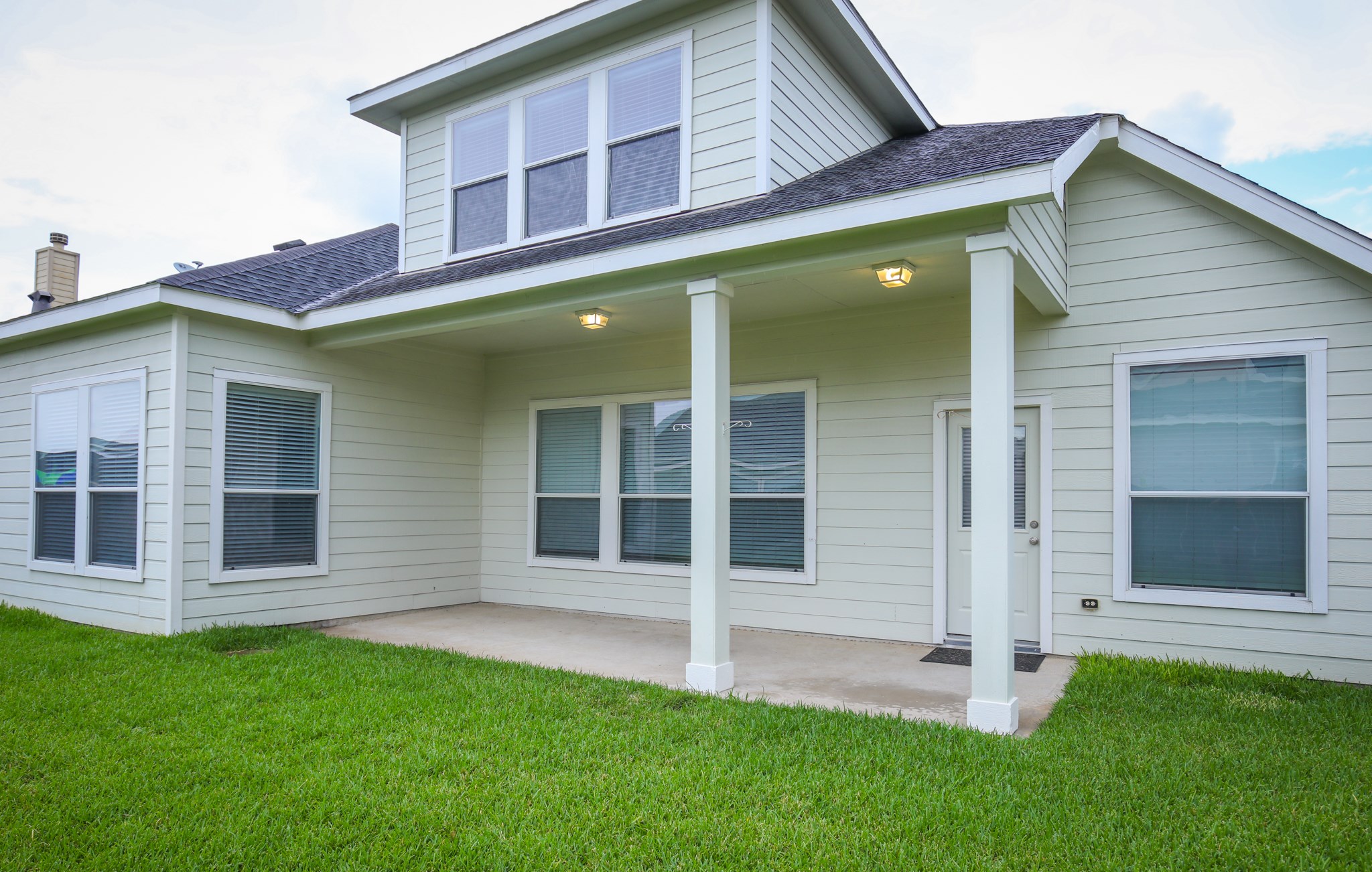 Backyard Spacious covered porch approx. 23X11 has lots potential; BBQ, pets house cages, even outdoor kitchen...