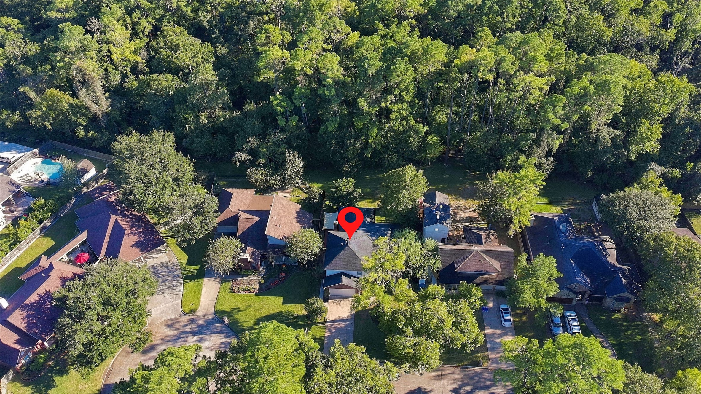 Aerial view of house and green space