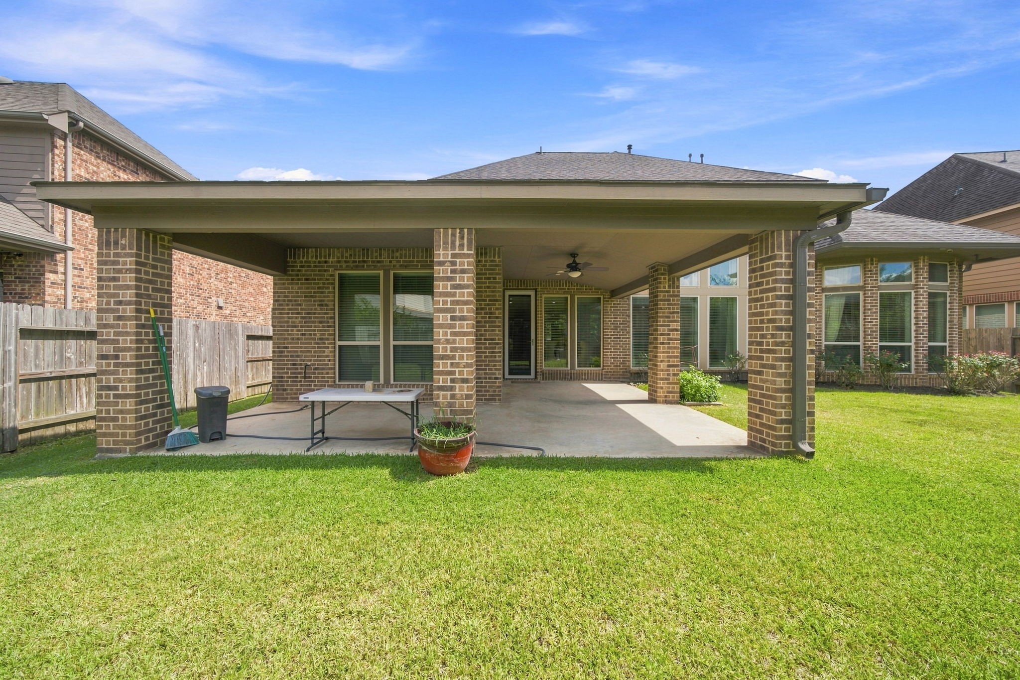 Step outside to your own inviting covered extended patio, ideal for morning coffee, weekend gatherings, and relaxing while overlooking the spacious, well-maintained backyard.
