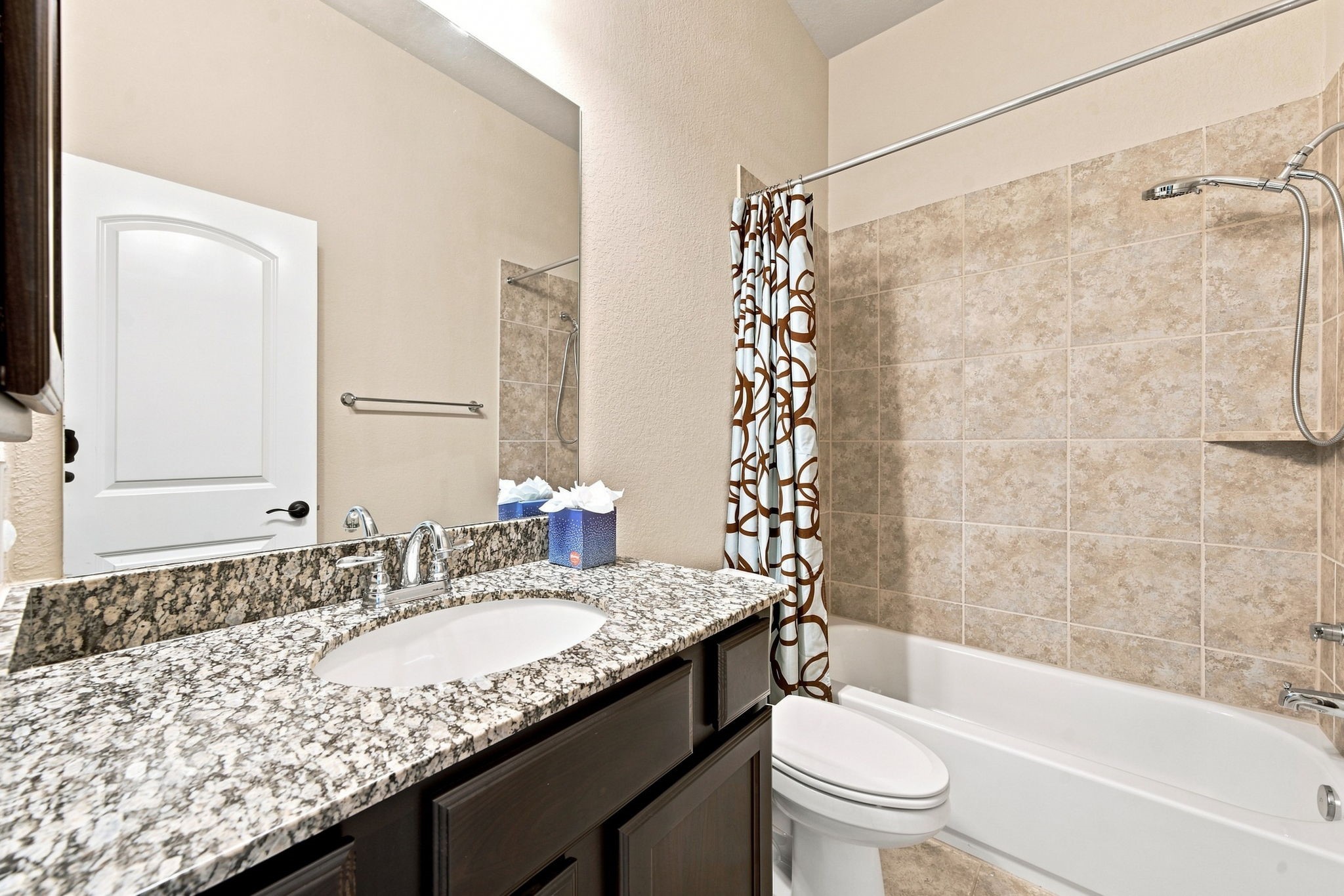 Well-appointed bathroom with a granite vanity and a tub/shower combination designed to fit comfortably into your daily lifestyle.