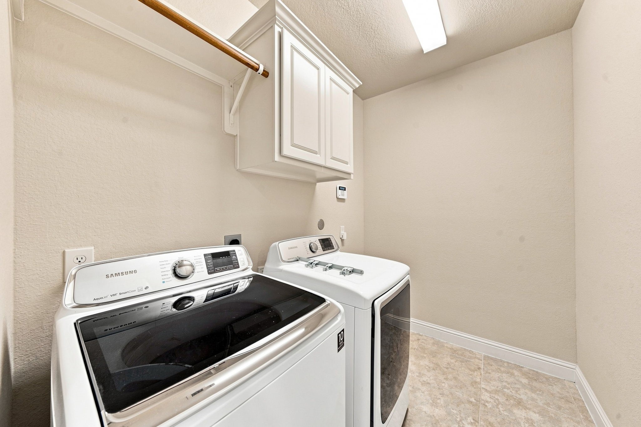 Dedicated laundry room with ample space for easy, organized laundry days.