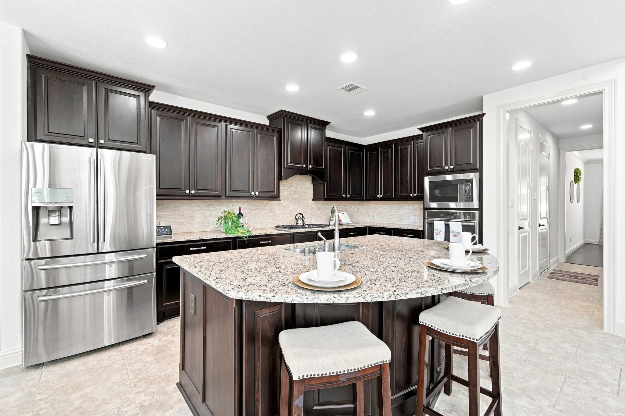Beautifully appointed kitchen with generous counter space made for effortless cooking and prep