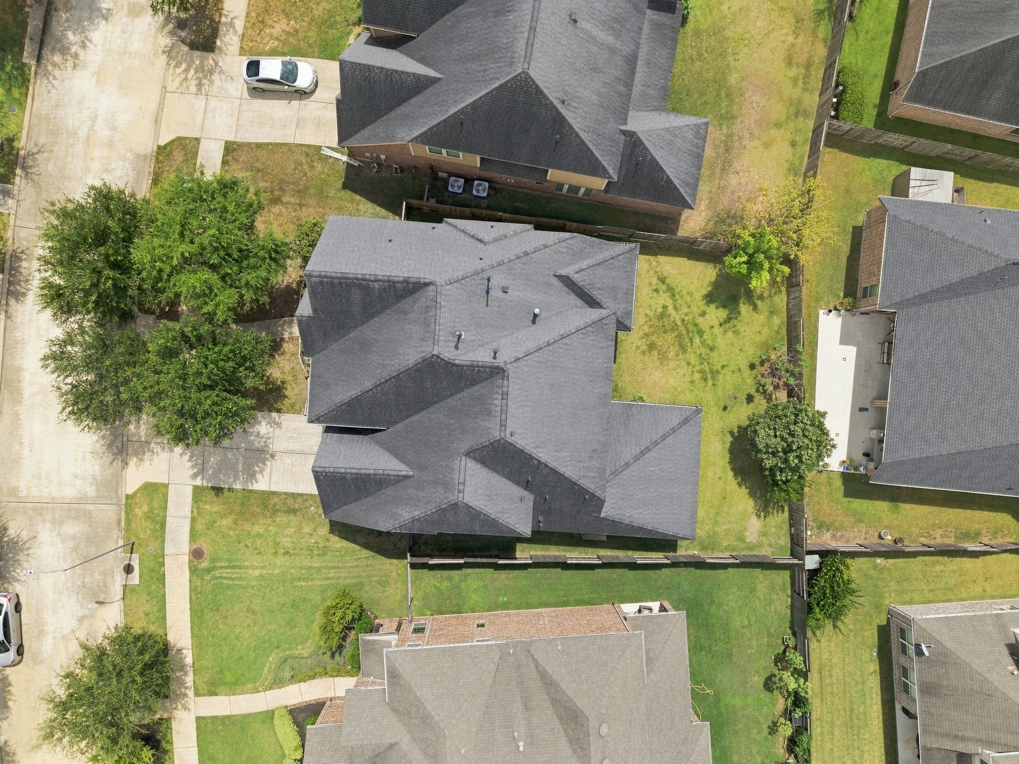 Overhead drone shot showing the home's roofline and footprint within the subdivision. Overhead drone shot showing the home's roofline and footprint within the subdivision.