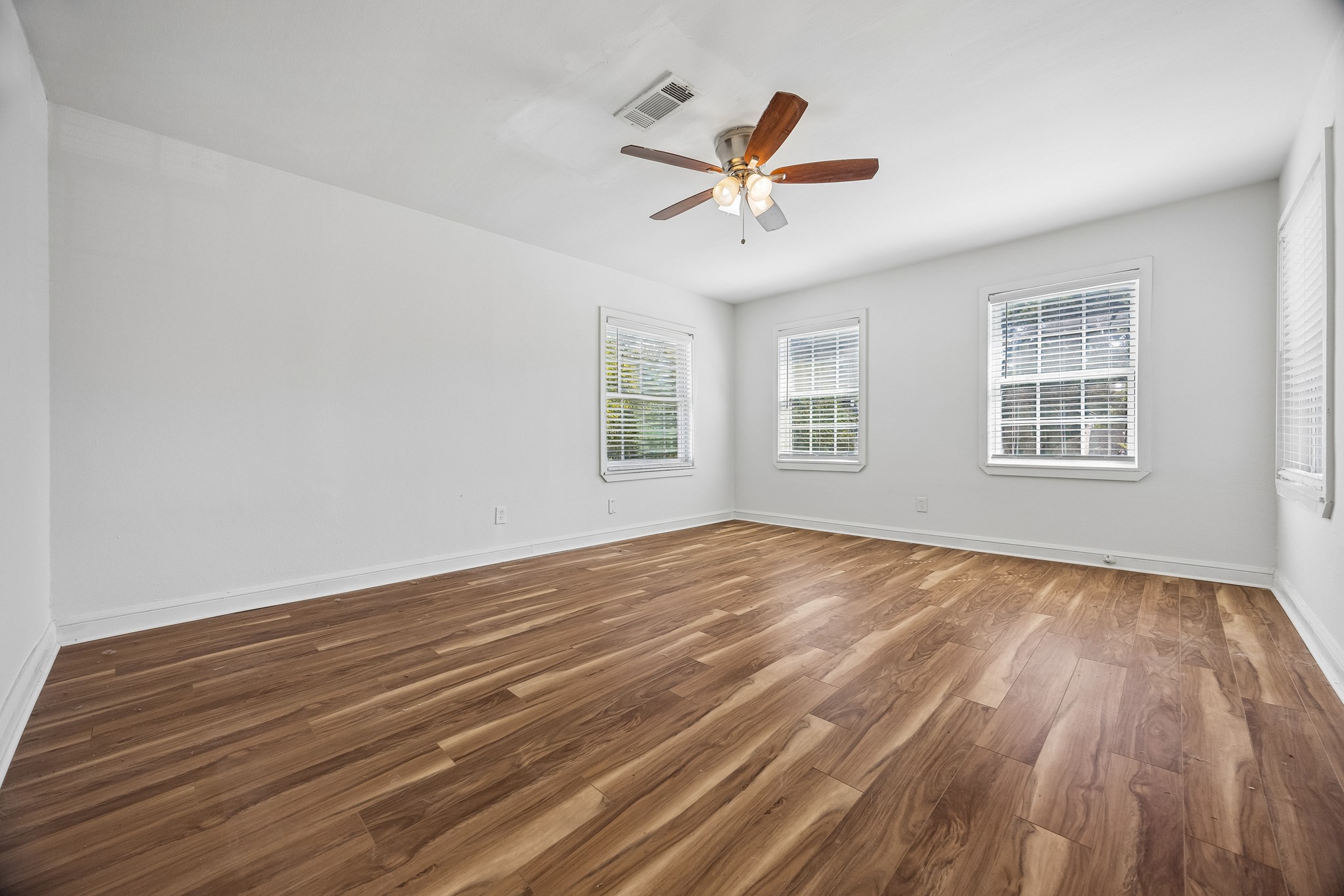 Bedroom on the second floor with ceiling fan.