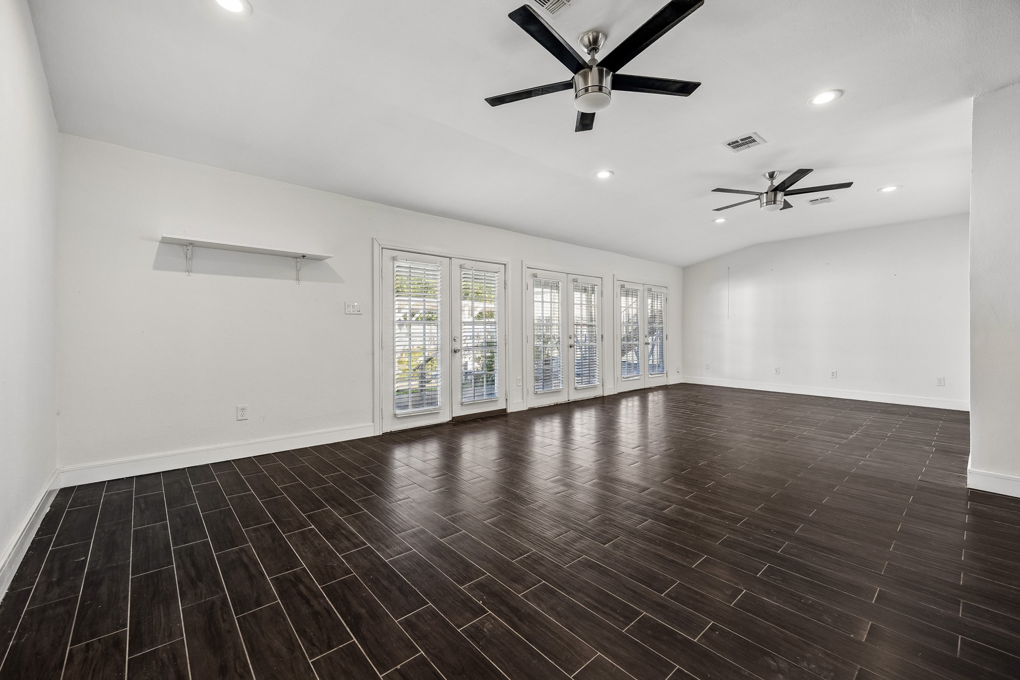 Family room with double French doors to the backyard.