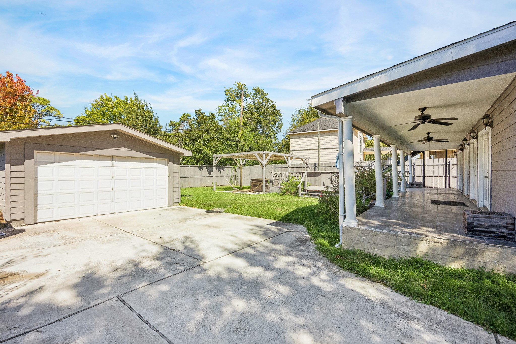 Detached garage and ling driveway.