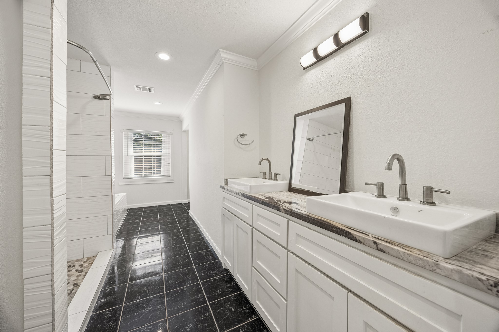 Primary bath with double sinks.