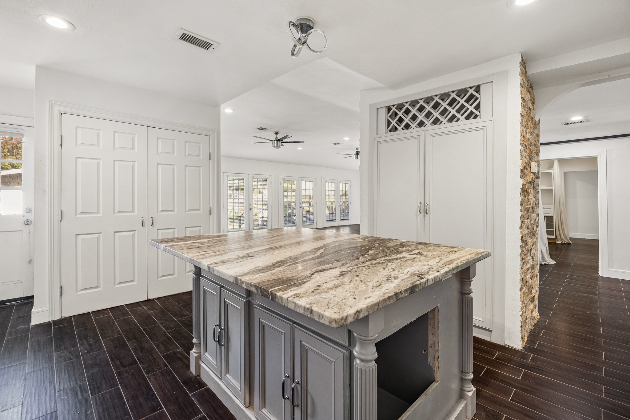 Island with seating overlooking the family room.