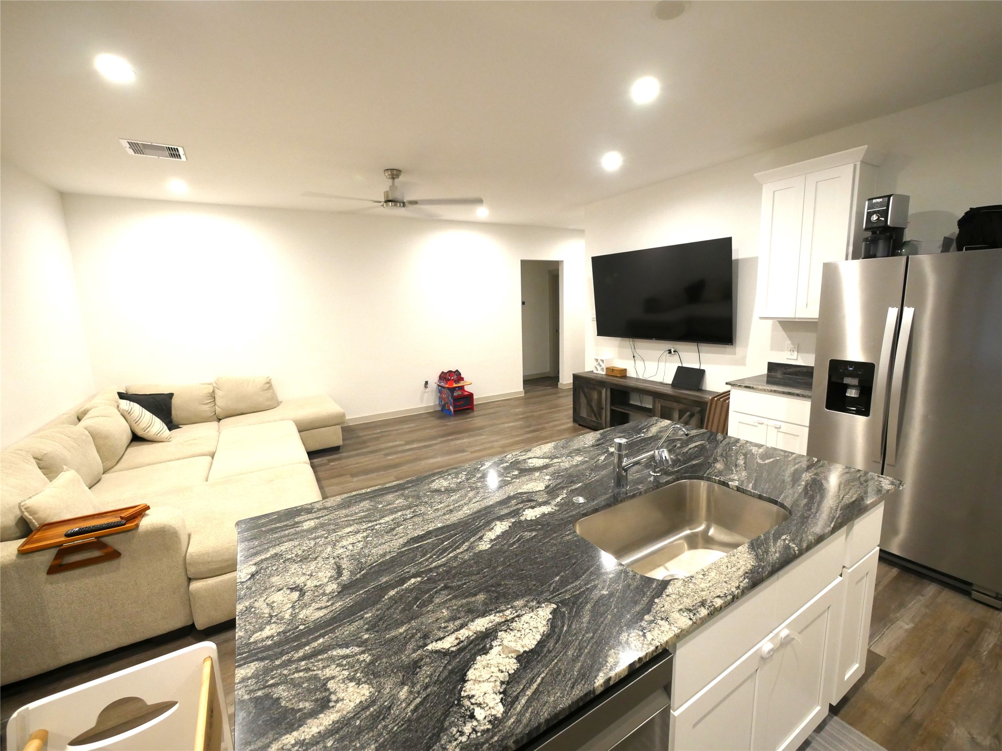 Beautifully appointed kitchen featuring a large island, gas range, ample cabinetry, and an open design ideal for everyday living and entertaining. Beautifully appointed kitchen featuring a large island, gas range, ample cabinetry, and an open design ideal for everyday living and entertaining.