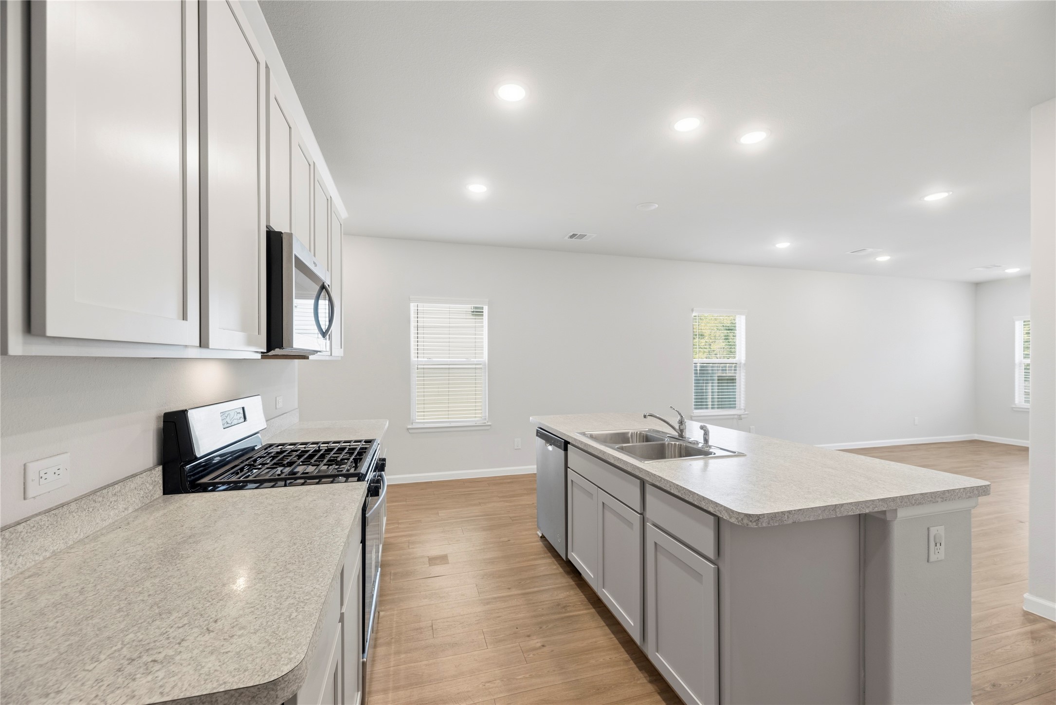 Prepare a meal while staying part of the conversation. The island faces the living area, giving the kitchen an open connection to the homes main gathering space.