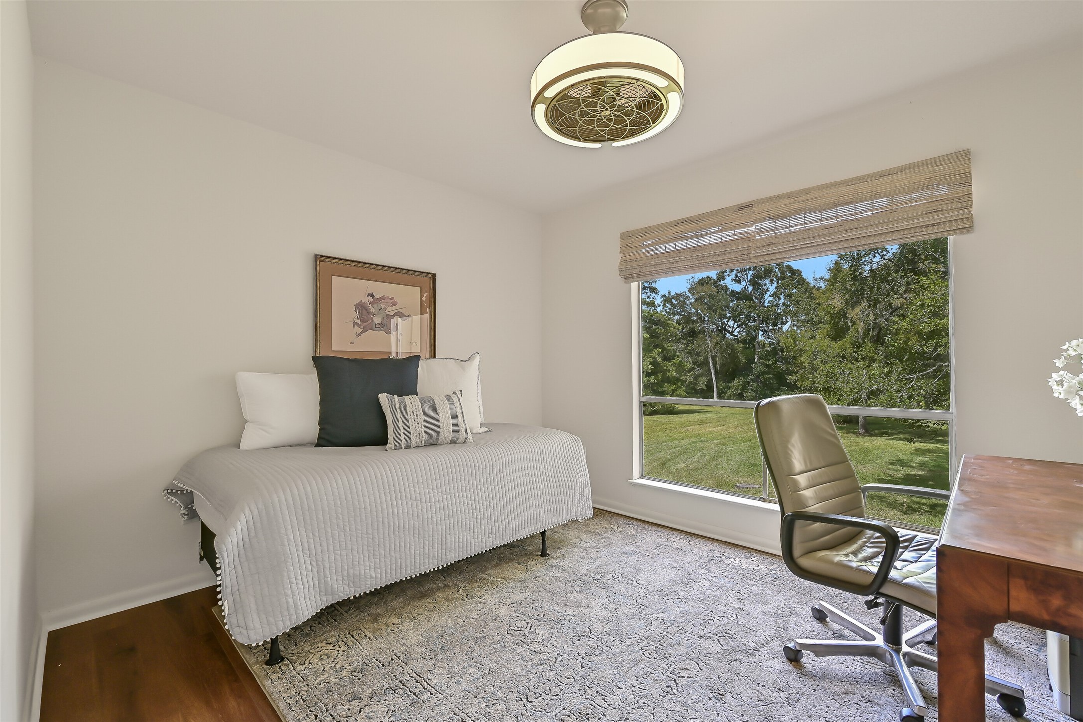 Currently arranged as a combination bedroom & office, this secondary bedroom features luxury vinyl plank flooring, neutral walls & a large picture window overlooking the beautiful backyard. A walk-in closet provides additional storage, while the adjoining Jack & Jill bath adds convenience.