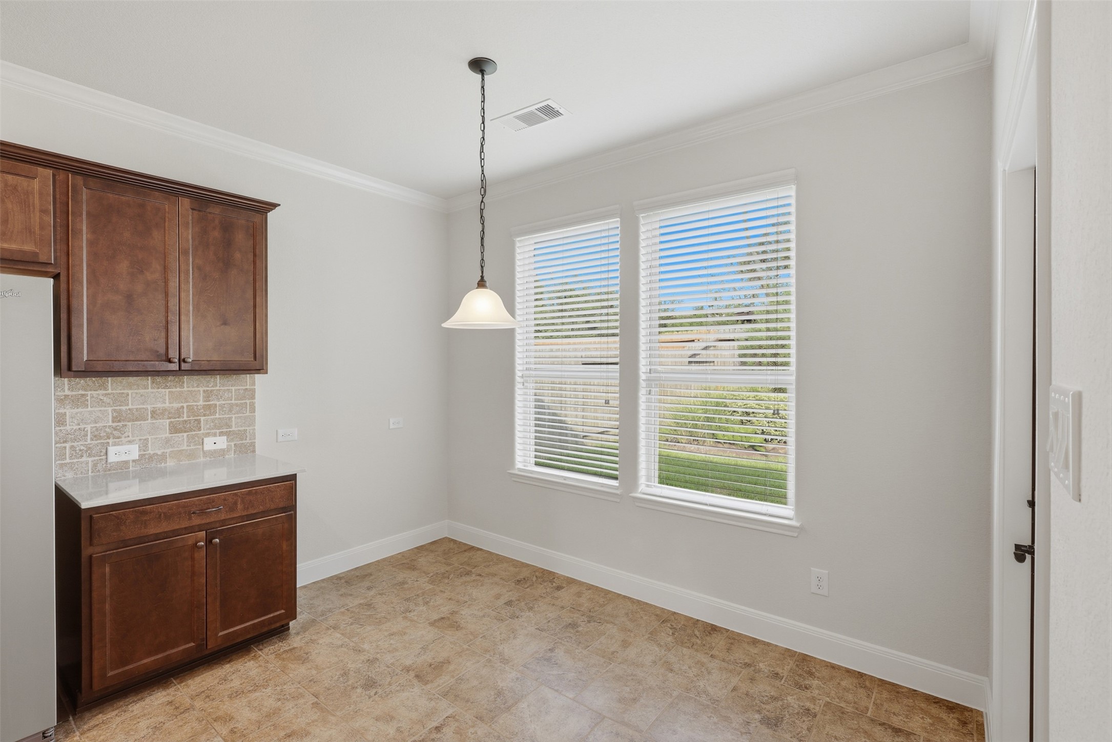 Breakfast area w/ extra cabinet space.