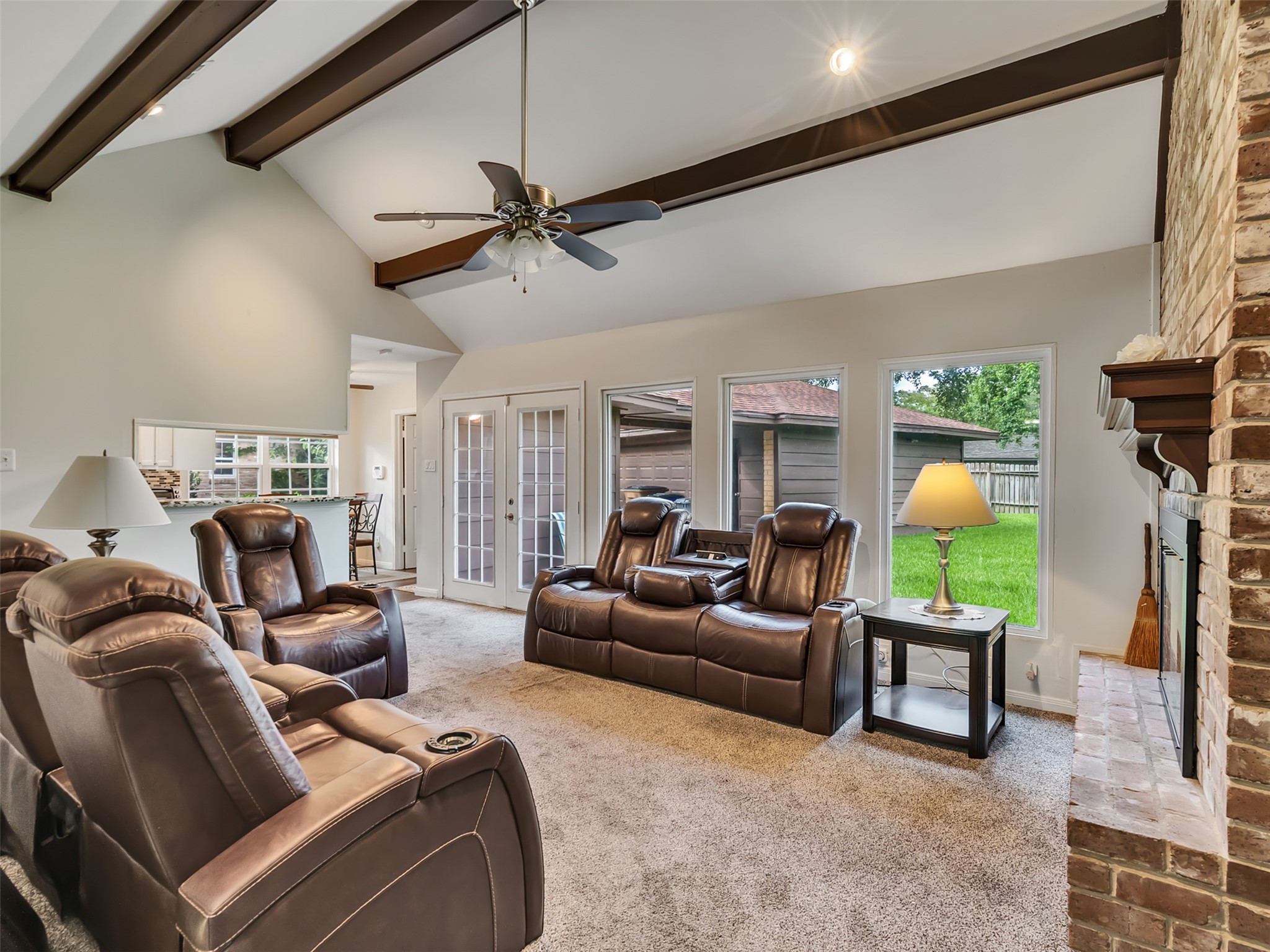 Soaring ceilings and stunning exposed beams create a space that feels both grand and inviting.  Architectural charm and timeless character shine in every detail.