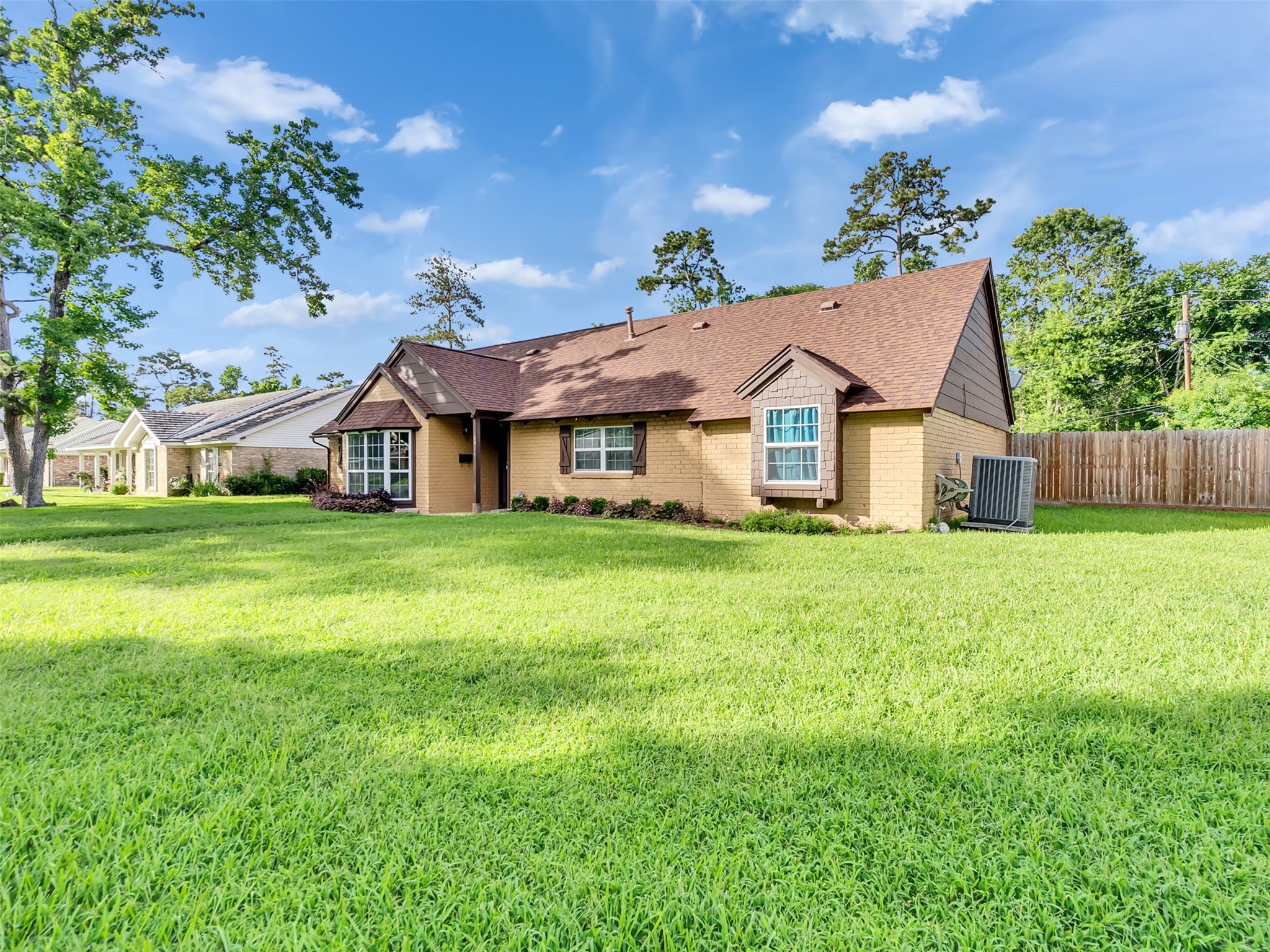This expansive home features a thoughtfully designed layout with spacious living areas, soaring ceilings, and large windows that showcase the evening ambiance. This expansive home features a thoughtfully designed layout with spacious living areas, soaring ceilings, and large windows that showcase the evening ambiance.