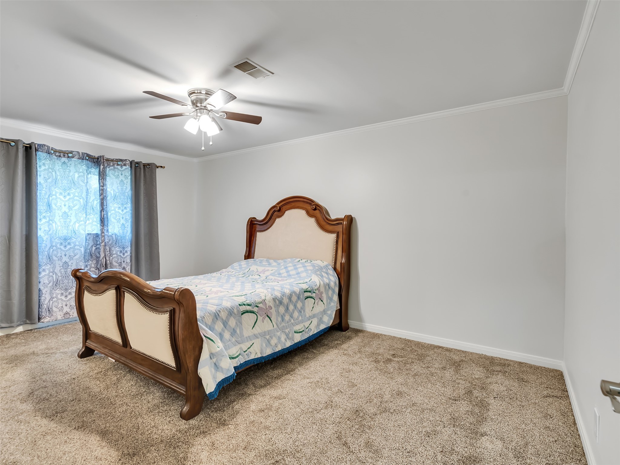 The spacious primary bedroom also located downstairs.