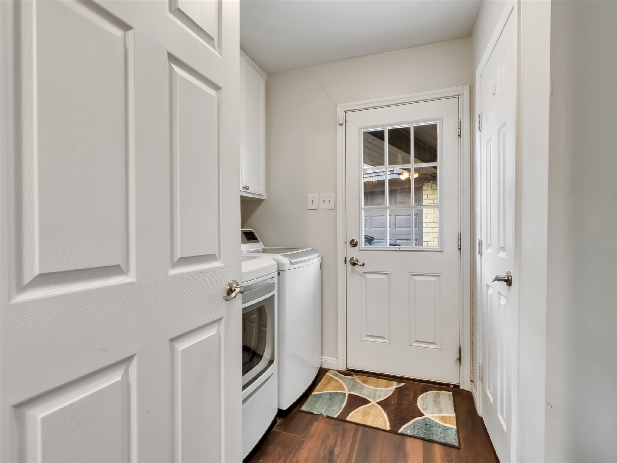 Function meets flexibility.  This spacious laundry room offers room for a washer, dryer, extra freezer, and pantry storage  giving you all the space you need to stay organized and keep everyday life running smoothly.