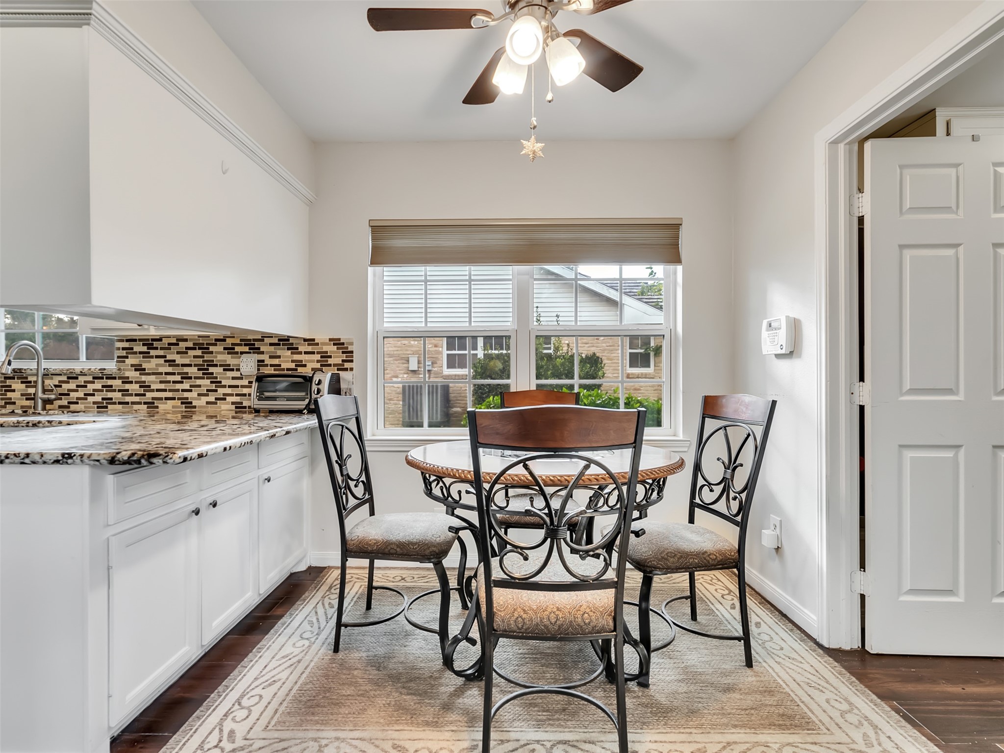 Morning coffee just feels better here.  This charming breakfast room is the perfect cozy spot to start your day, enjoy family meals, or unwind.