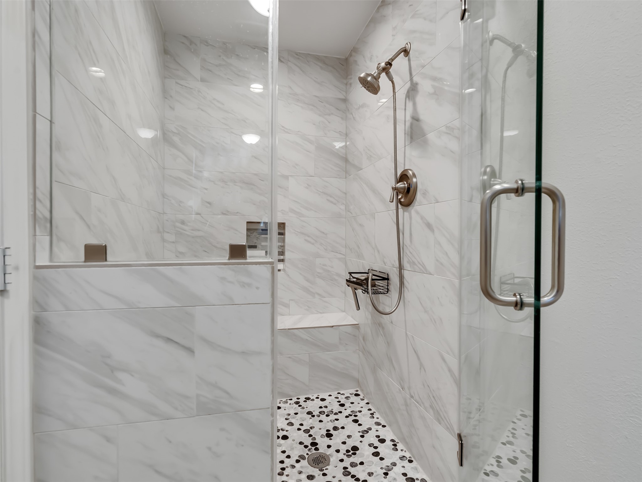 Spa-like comfort starts here.  This oversized shower features a built-in seat for added luxury, convenience, and the perfect place to relax and unwind.