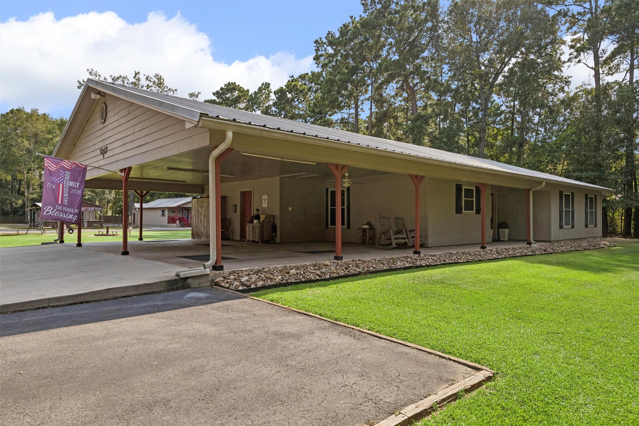 The Main Home with 3 car carport. Flooring has stamped concrete