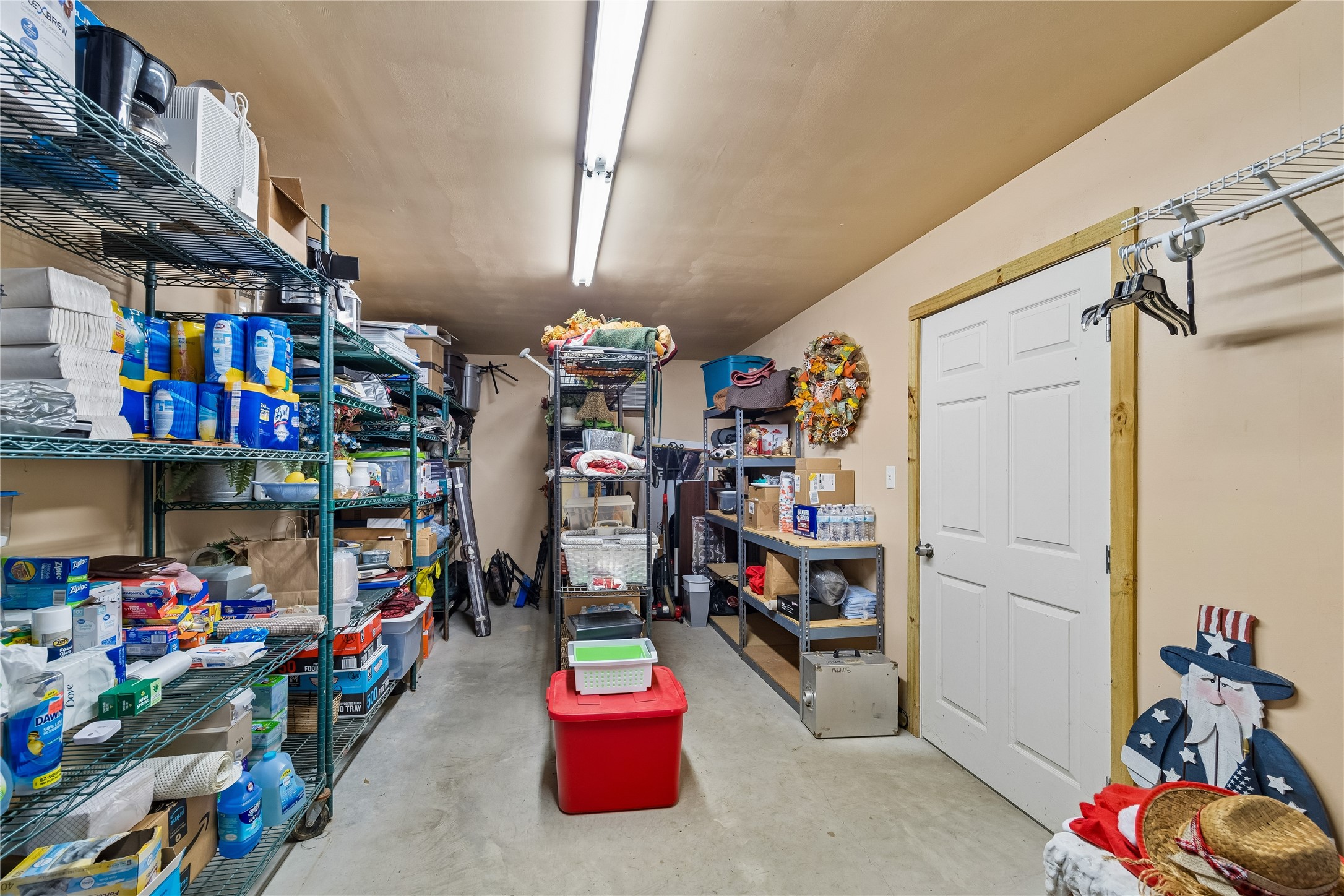 Huge storage closet in the workshop with commercial shelving
