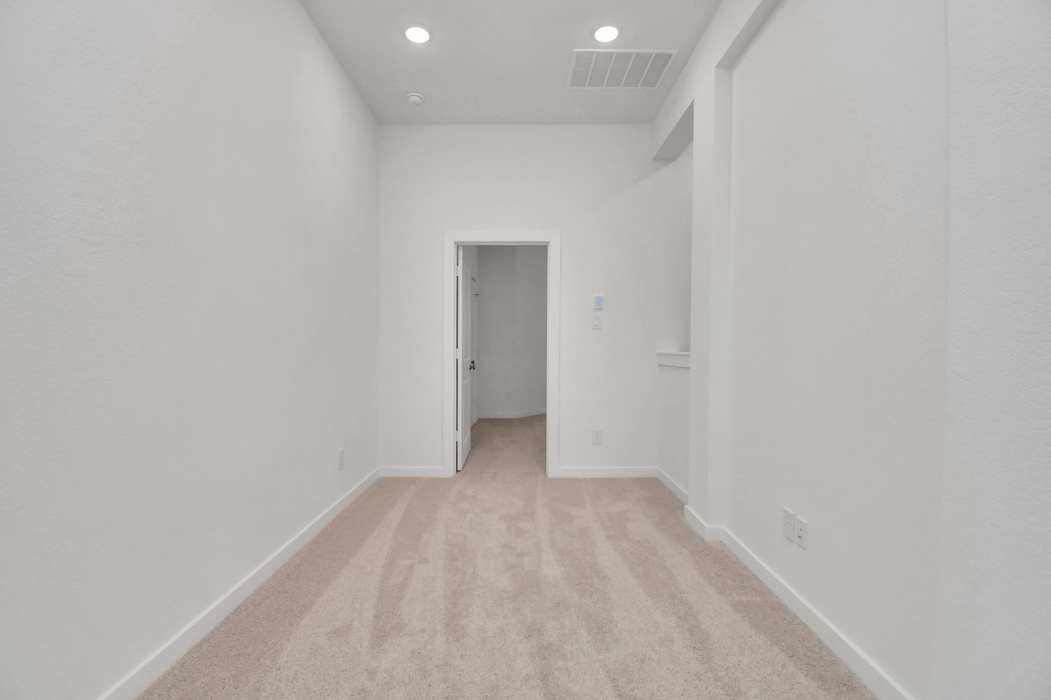 The large upstairs hallway provides ample space and natural light, creating a welcoming transition between rooms.