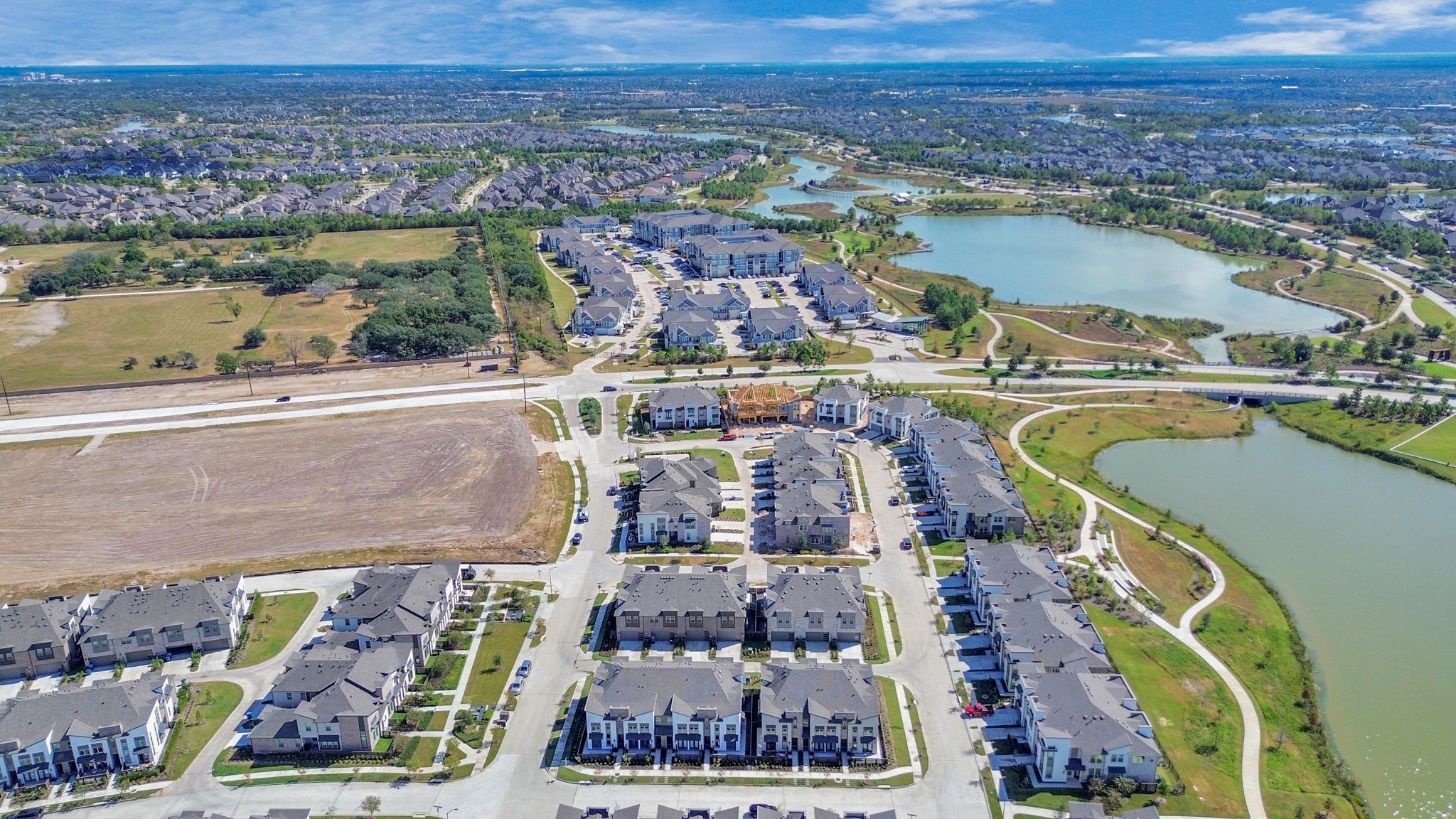 The aerial view shows the townhomes' prime location within the community