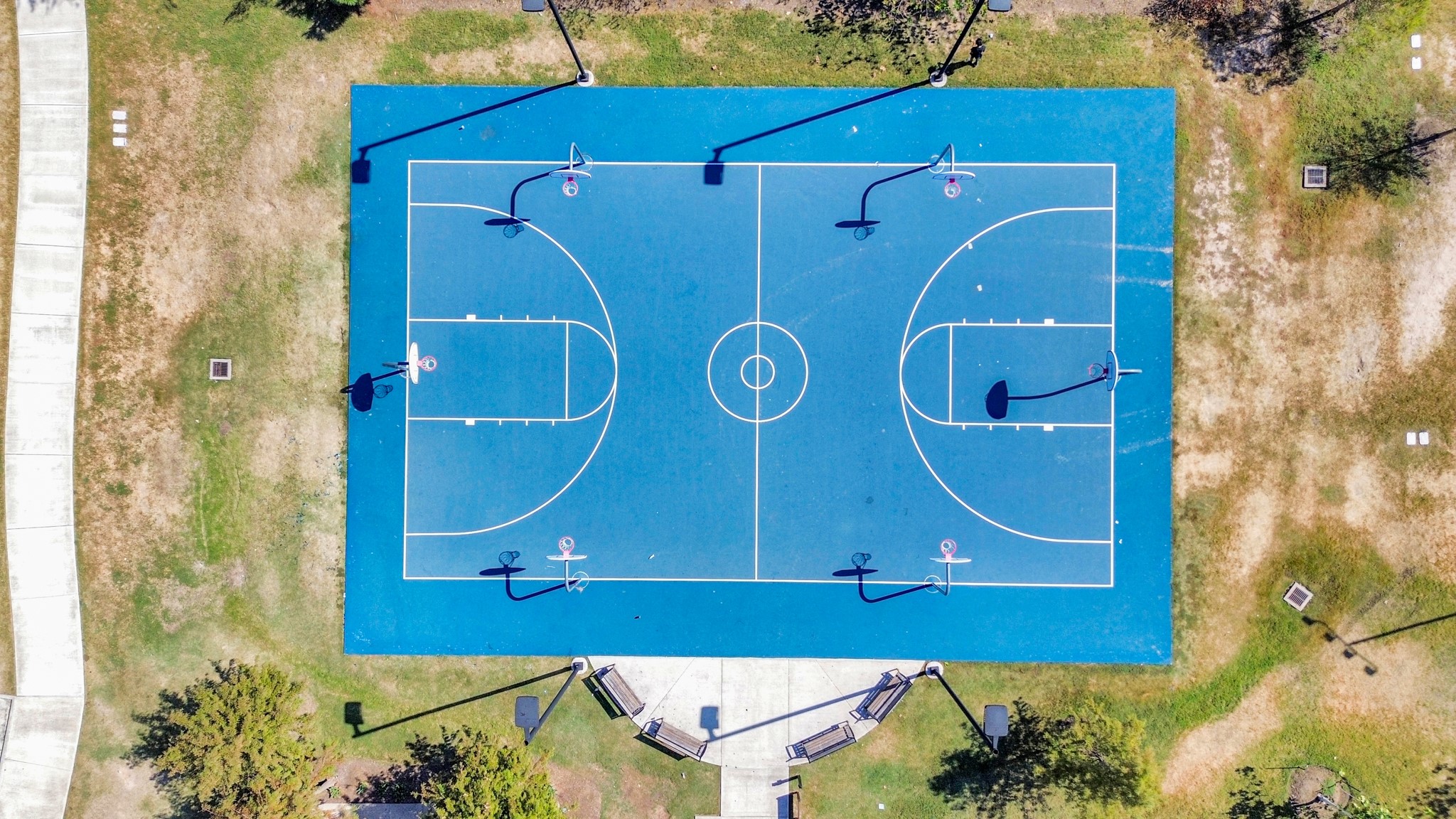 The community basketball court offers a vibrant space for residents to enjoy friendly games and exercise in a welcoming environment.