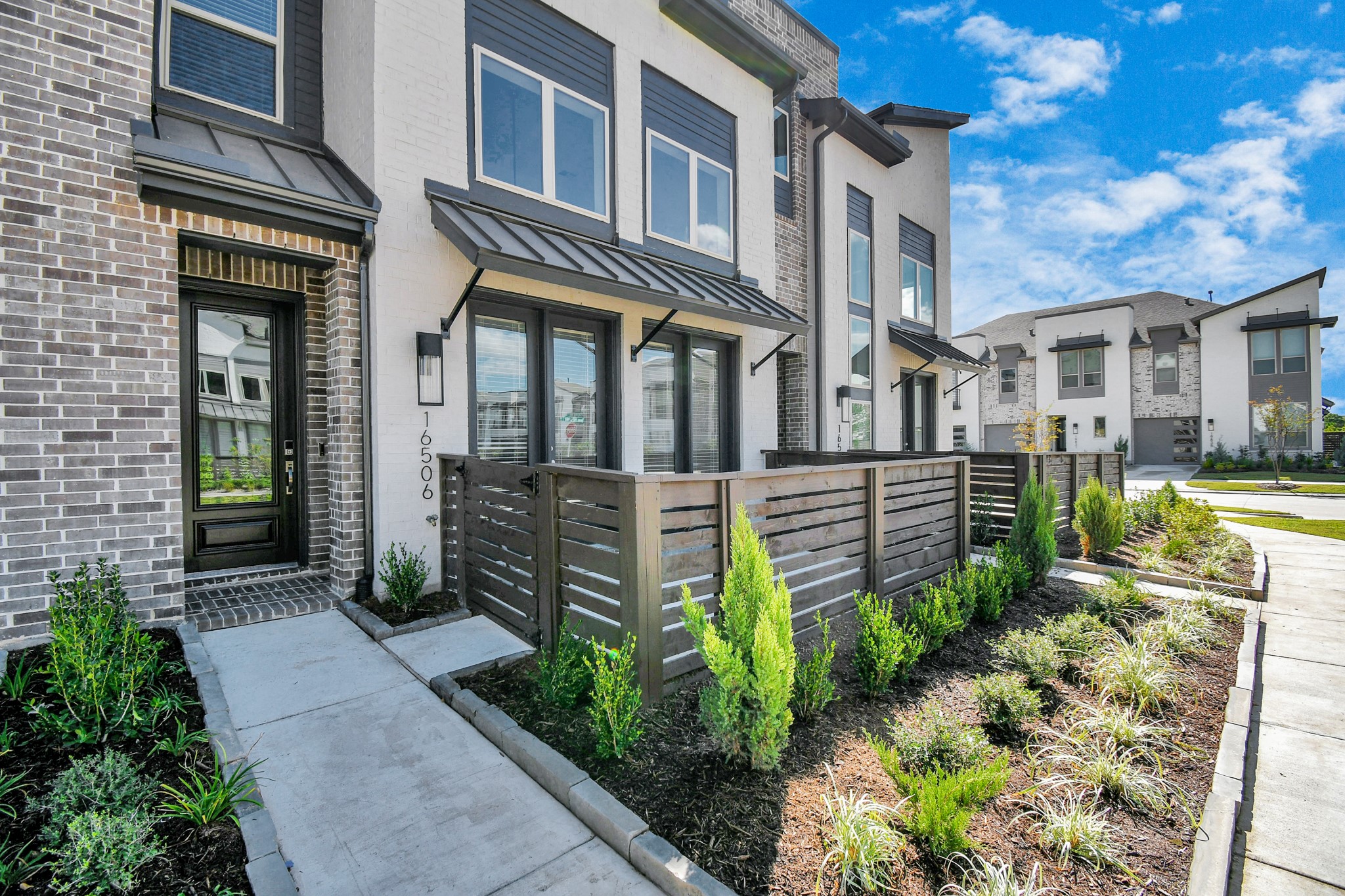 A stylish entryway and private patio add to its curb appeal, making it a perfect blend of functionality and elegance.