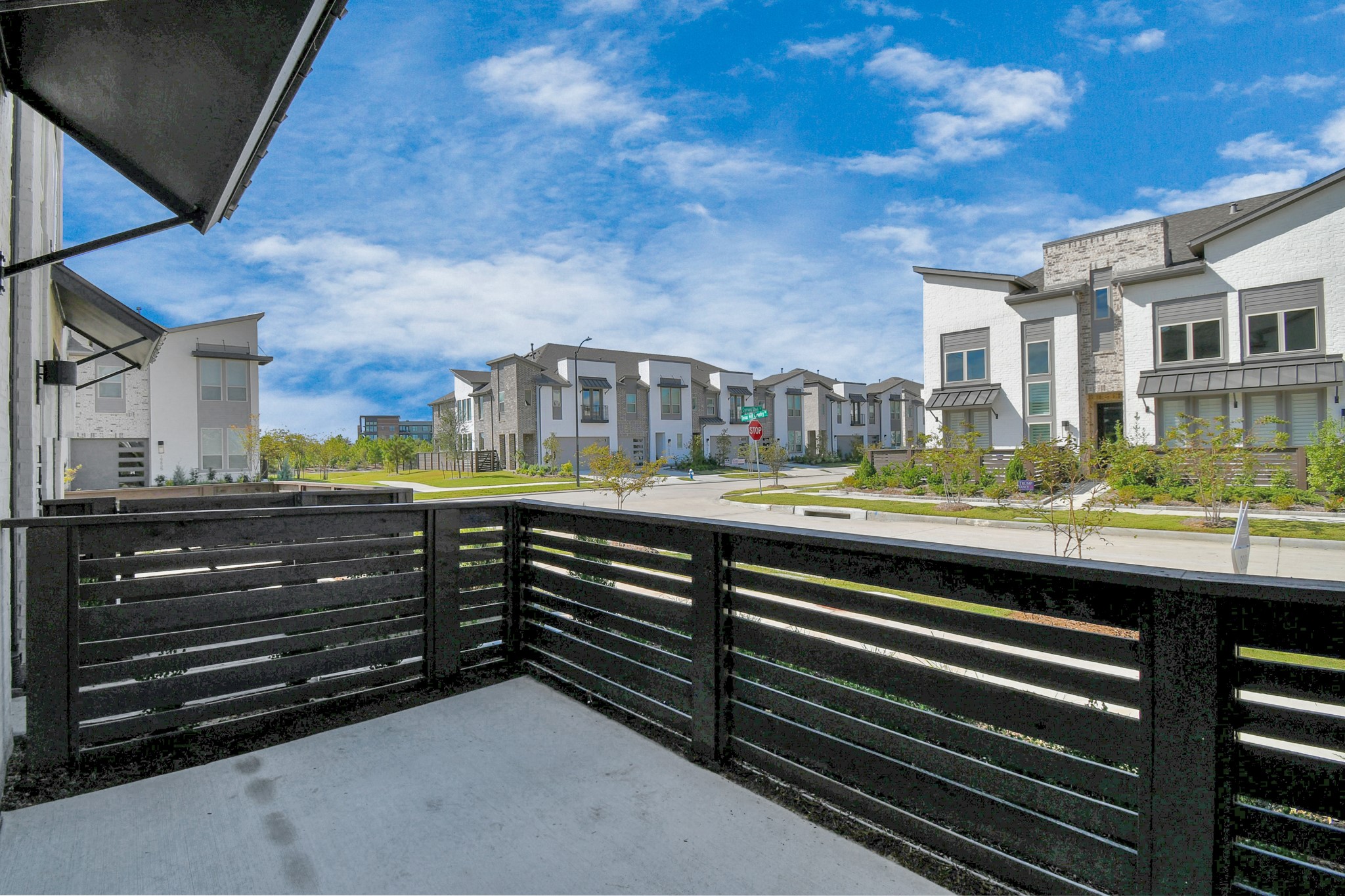 Enjoy a charming street view from the front patio, perfect for taking in the neighborhood ambiance.