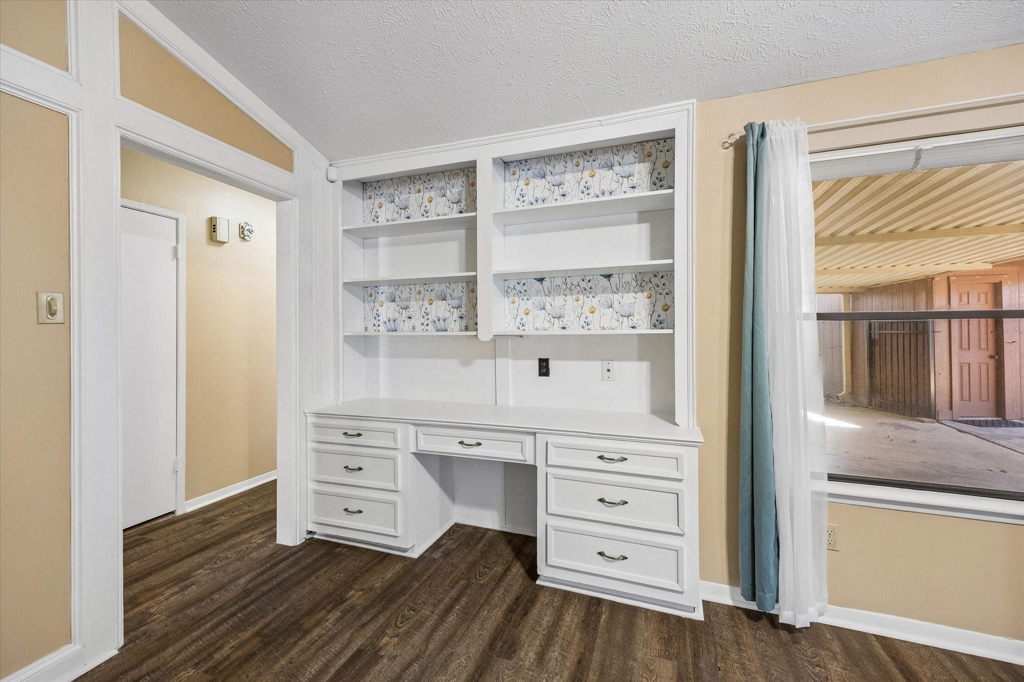 Charming built-in desk with ample shelving and storage.