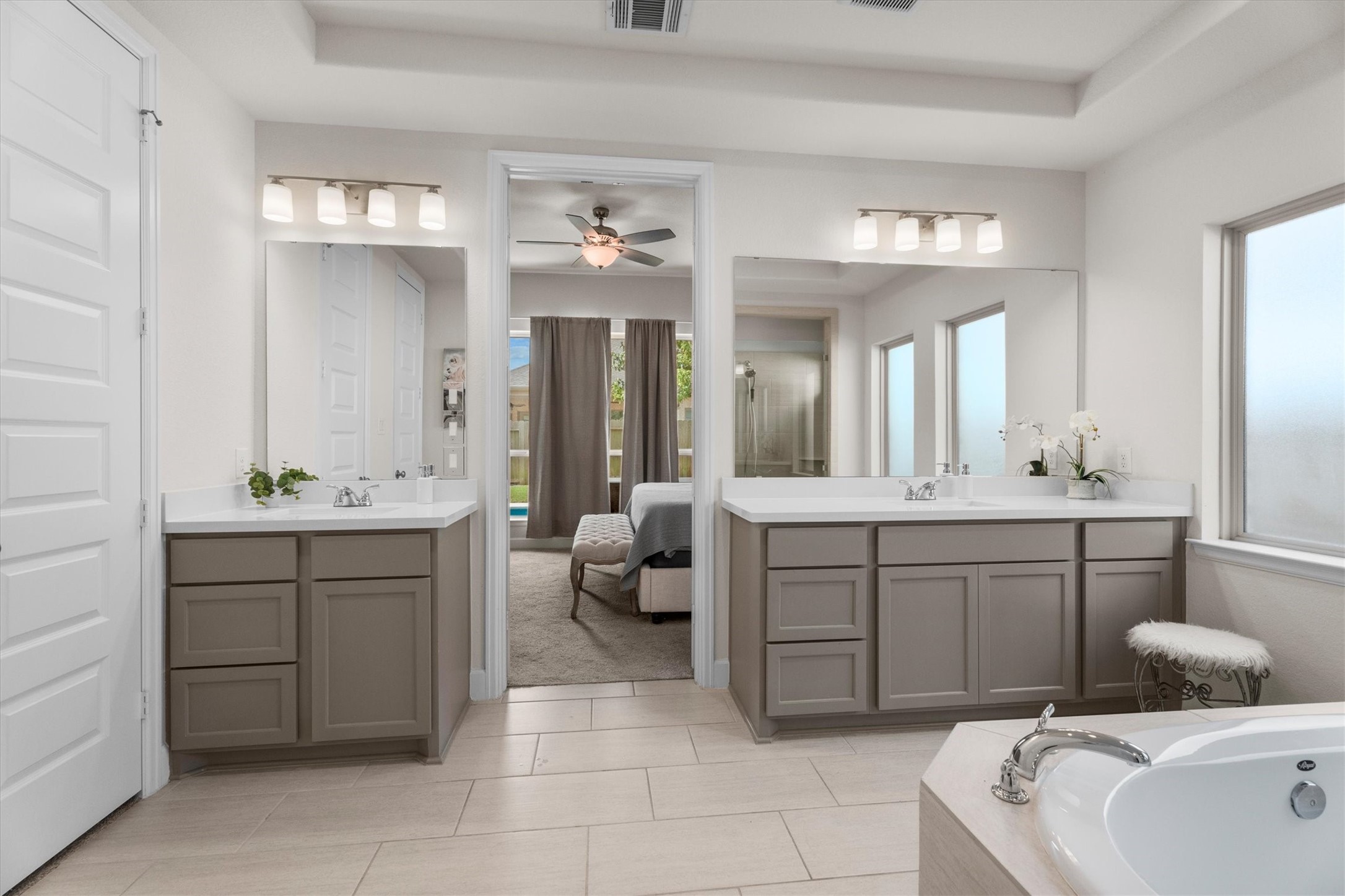 The perfect blend of function and luxury with separate vanities, abundant storage, and room to truly unwind.