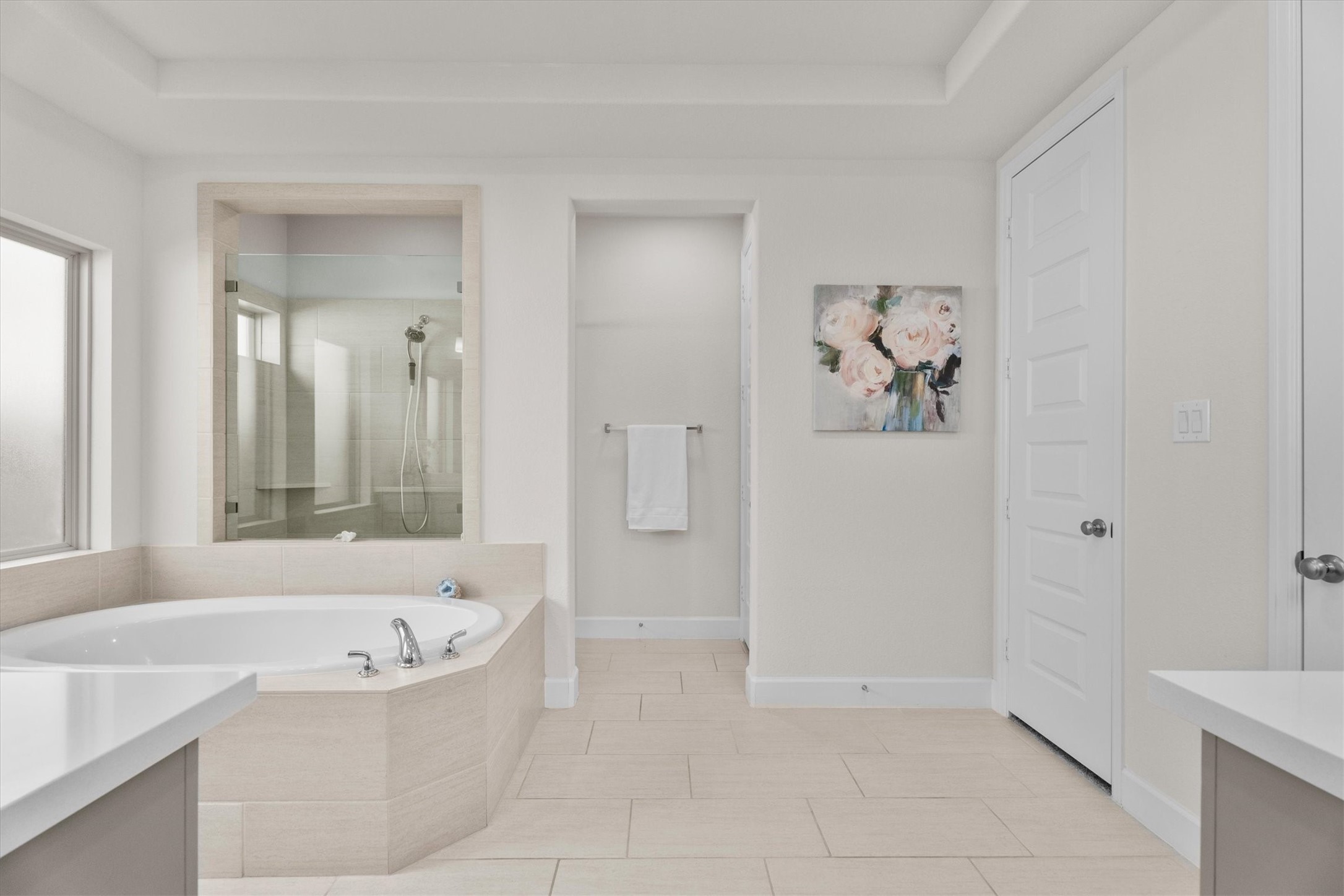 Start and end each day in a spa-inspired ensuite featuring a soaking tub, oversized shower, dual vanities, and two closets.