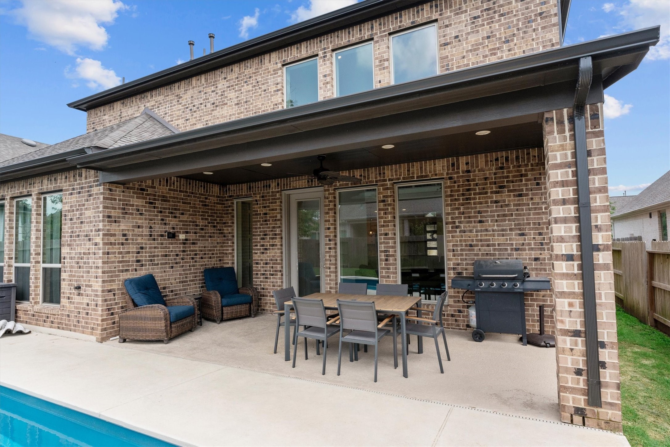 Designed for both relaxation and entertaining, this backyard is ready for every season.