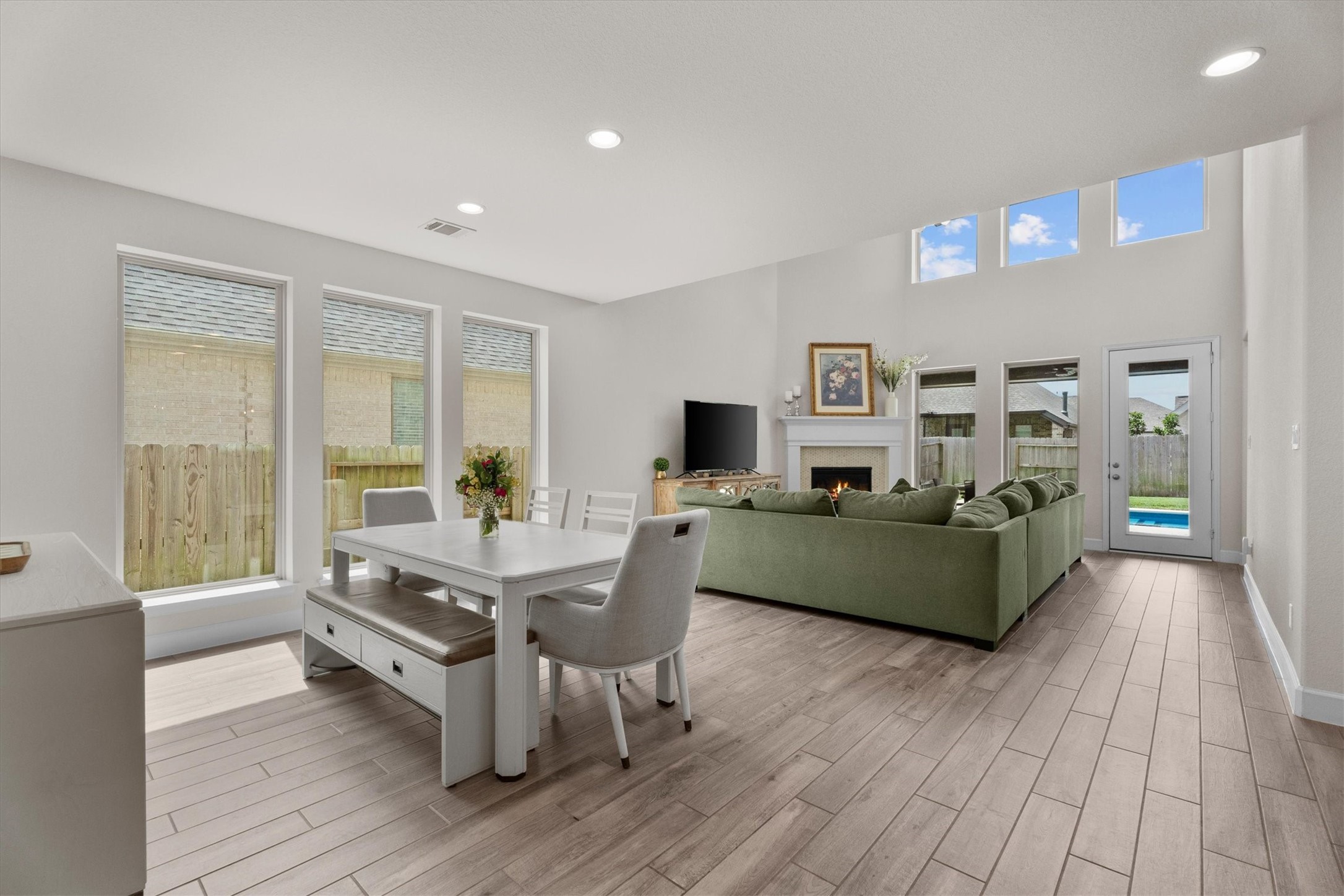 From cozy evenings by the fireplace to hosting family and friends, this spacious living area was designed to bring people together.