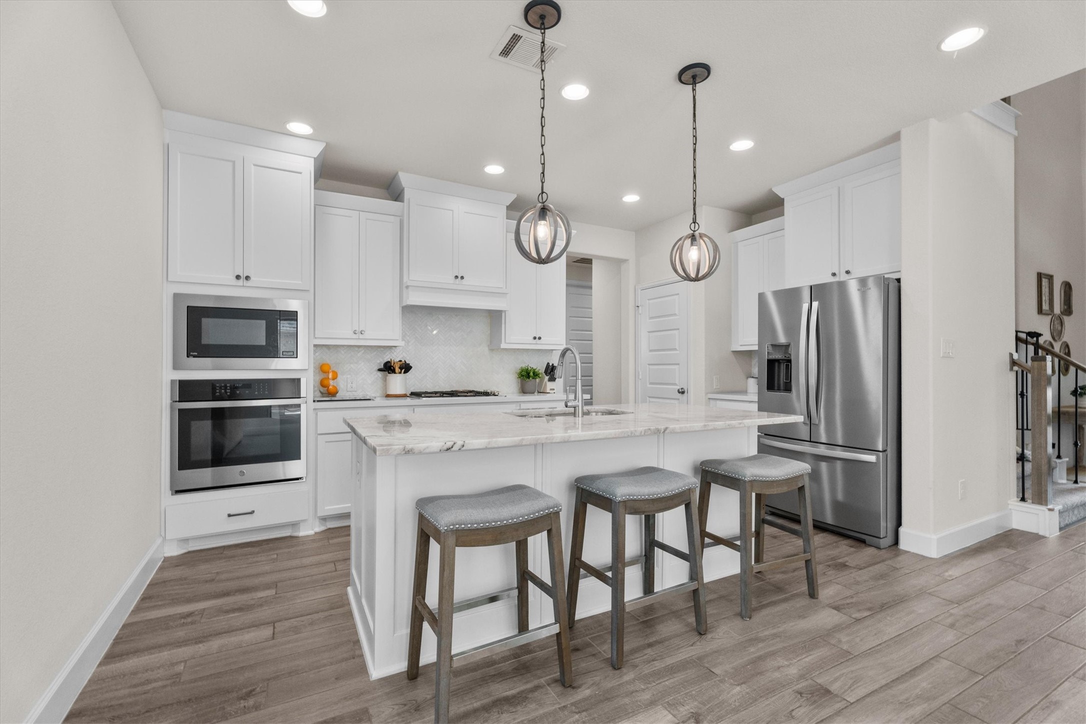 Gather around the kitchen where conversations, celebrations, and everyday moments naturally come together.