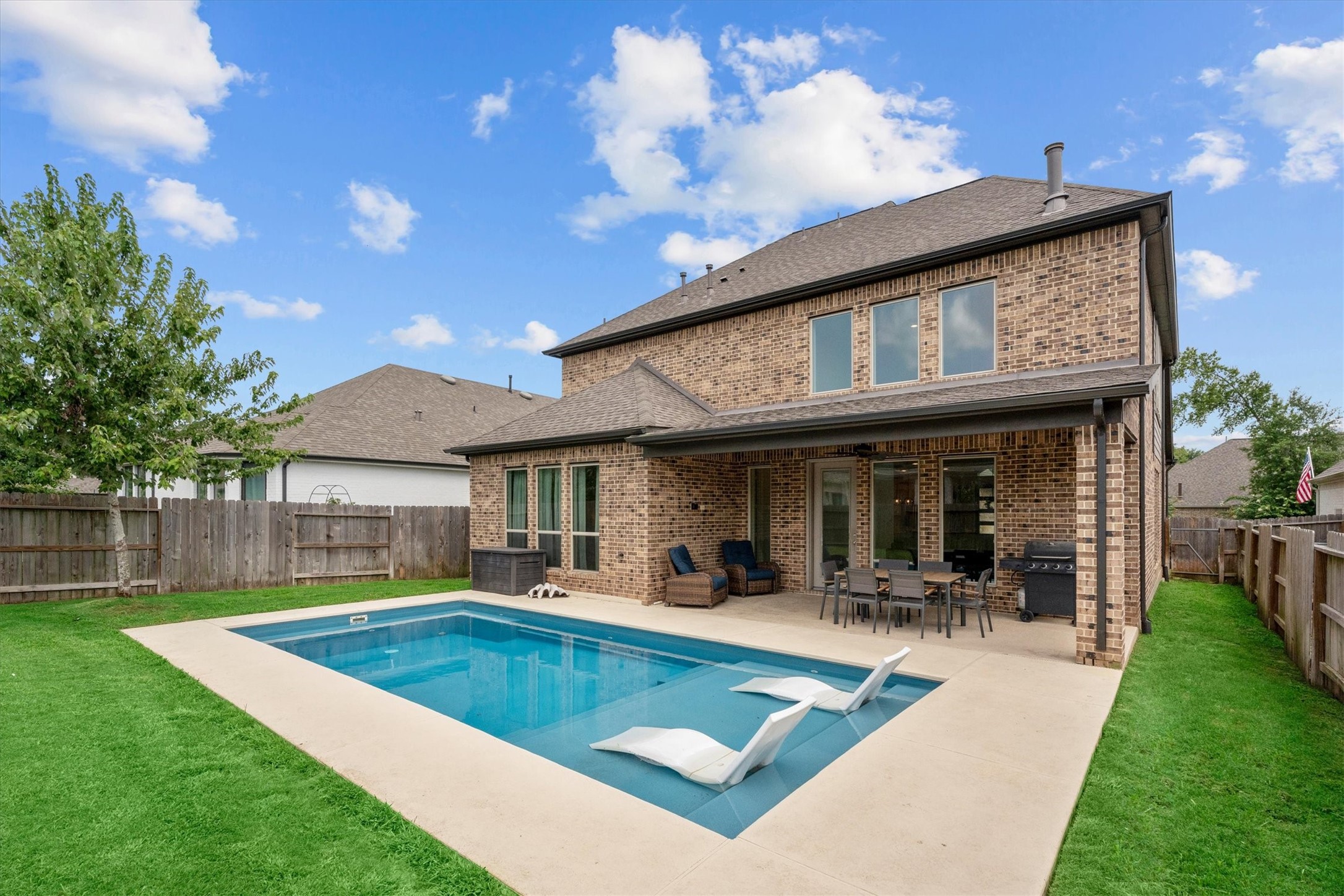 Your own private retreat, where summer afternoons become pool days and evenings are made for gathering under the covered patio. Your own private retreat, where summer afternoons become pool days and evenings are made for gathering under the covered patio.