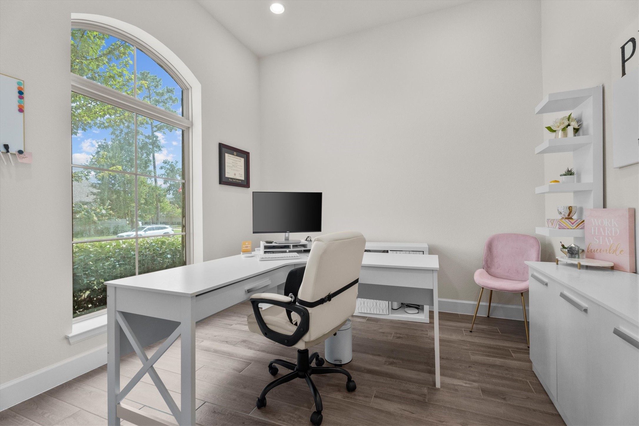 French doors create the perfect private workspace, while front-facing windows fill the room with natural light.