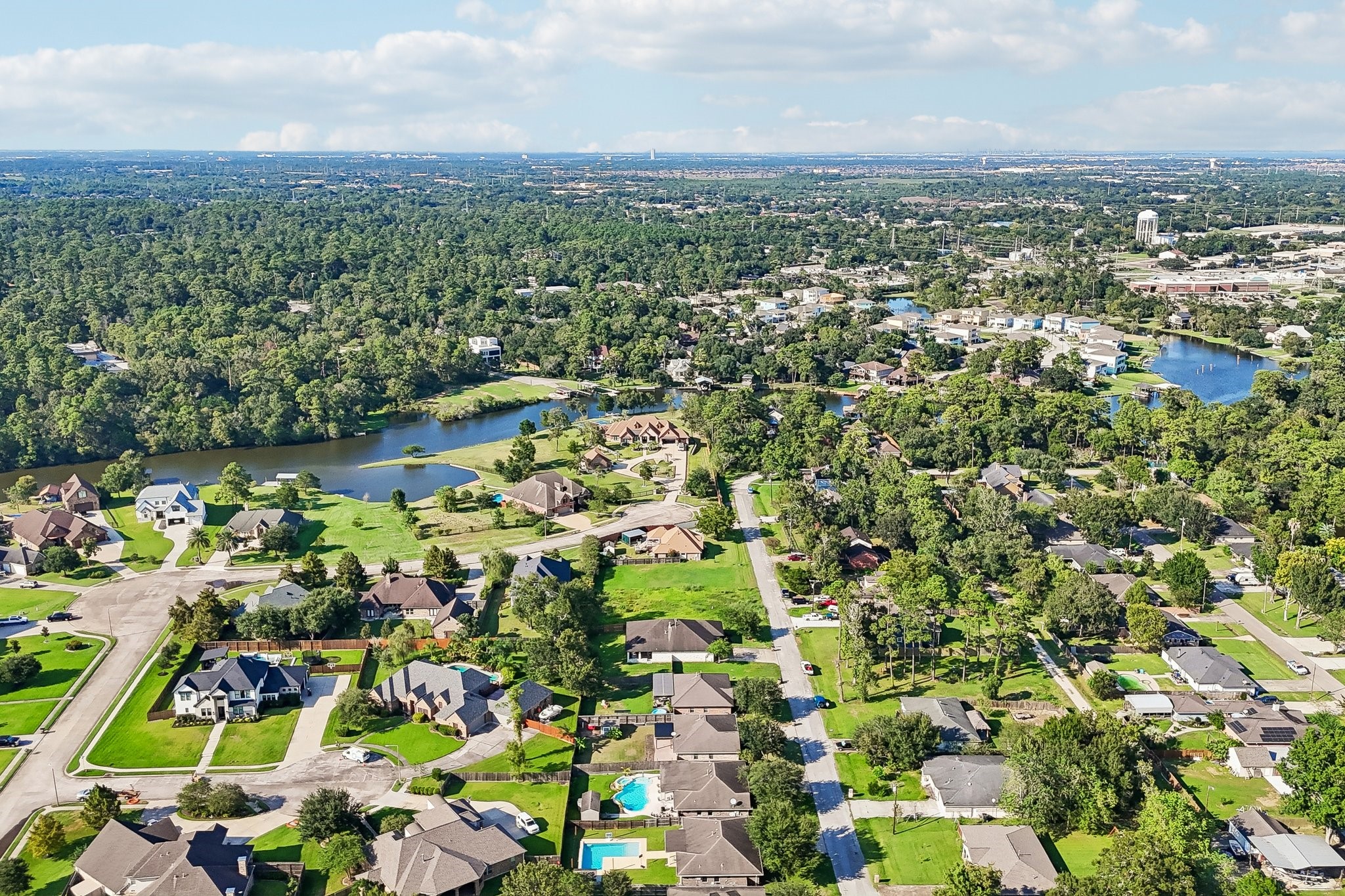 Nestled in a lush, wooded setting, this community boasts beautiful homes with spacious yards, serene lakes, and abundant green spaces, offering a perfect blend of nature and suburban living.