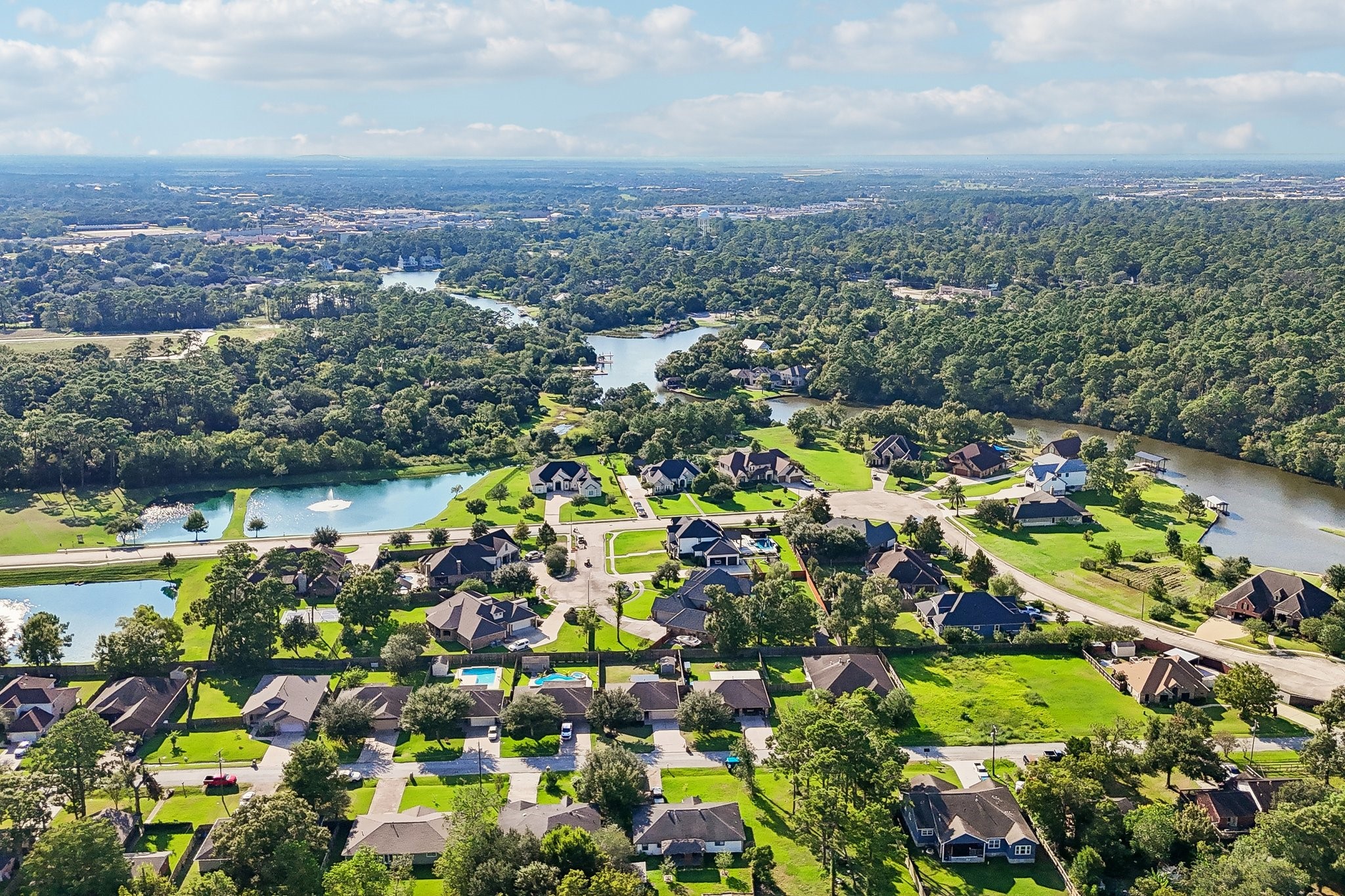 Nestled in a serene, lush landscape, this charming neighborhood offers waterfront views and spacious homes, perfect for tranquil living.