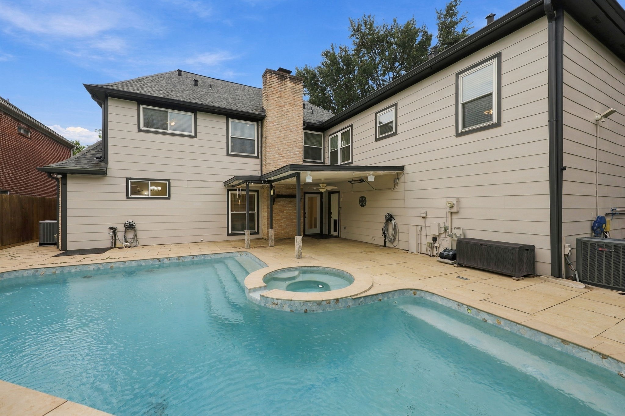 Take advantage of the private backyard oasis with a beautifully designed pool, integrated spa, decorative water features, and a spacious surrounding deck.