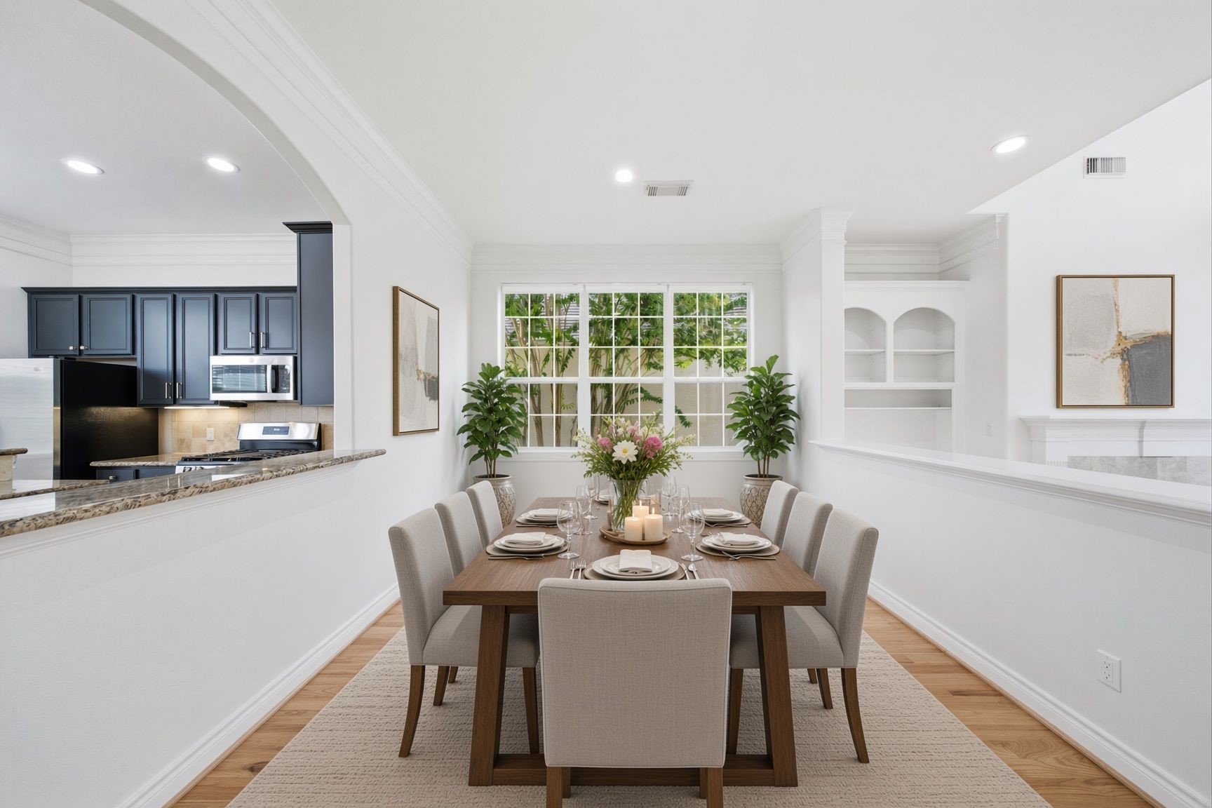 Staged photo of dining room adjacent to the living room. Great space to entertain.
