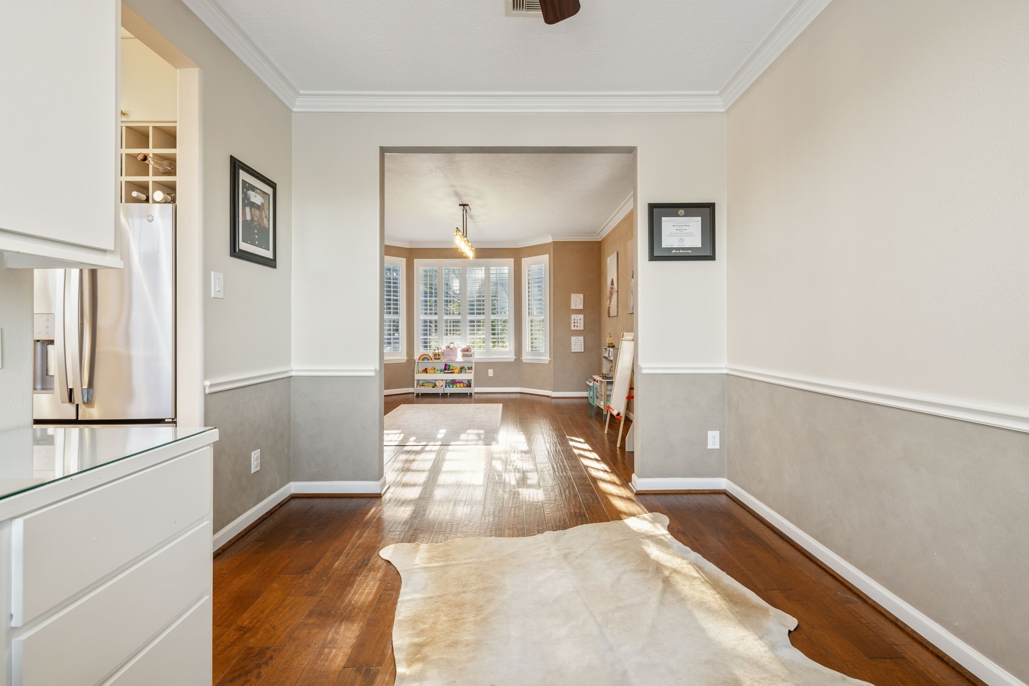 An additional perspective highlights the office's generous proportions and seamless connection to the adjoining dining room. An additional perspective highlights the office's generous proportions and seamless connection to the adjoining dining room.