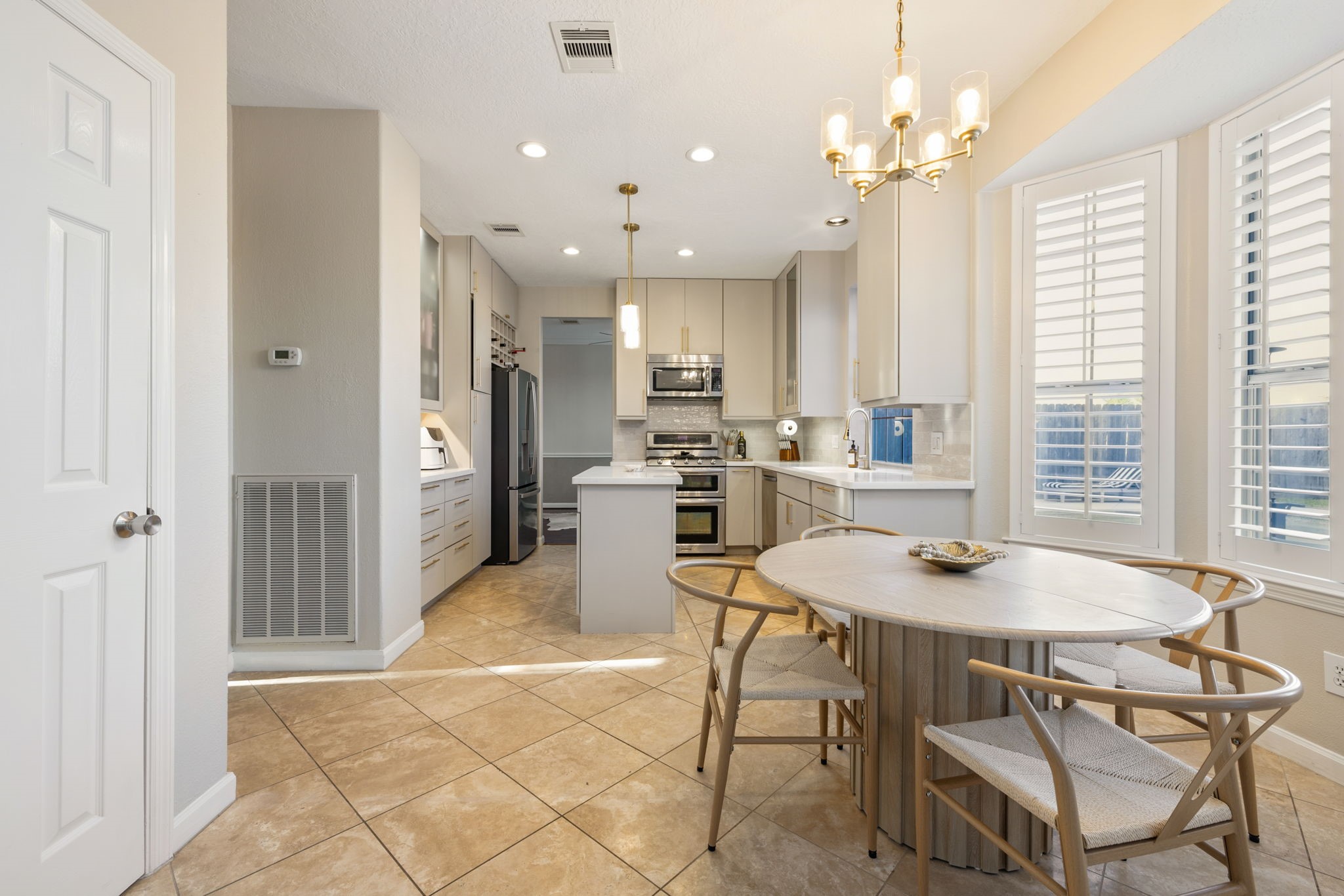 A thoughtfully designed kitchen and breakfast area with generous counter space and effortless flow.